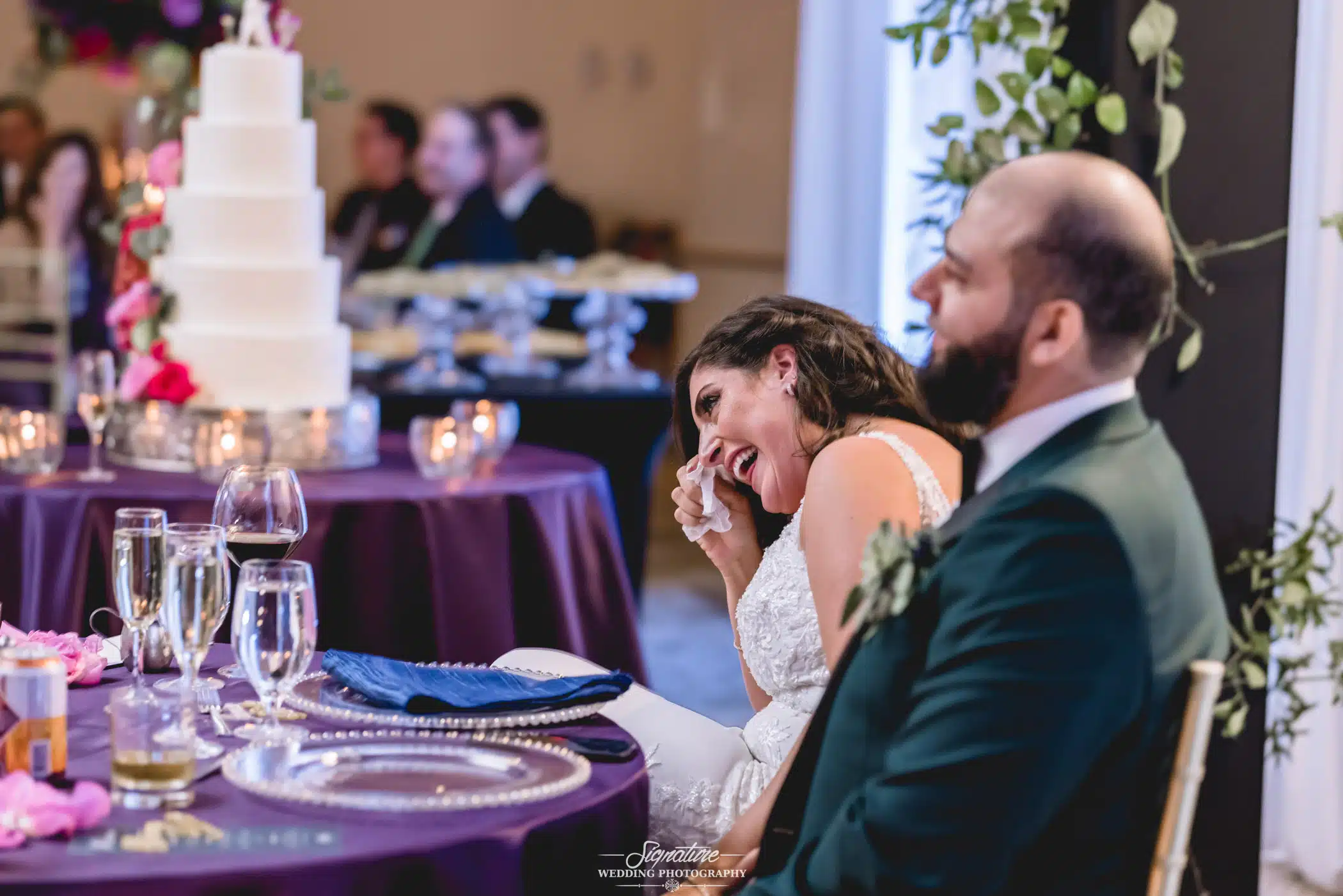 Bride laughing wiping tears