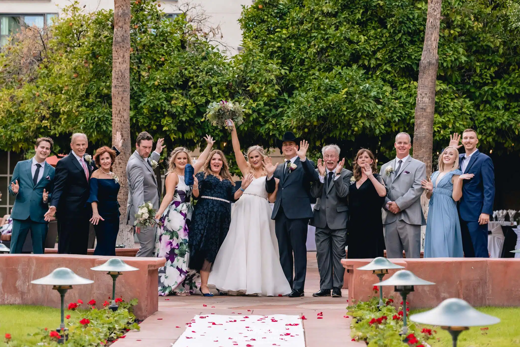 Bride and groom with family