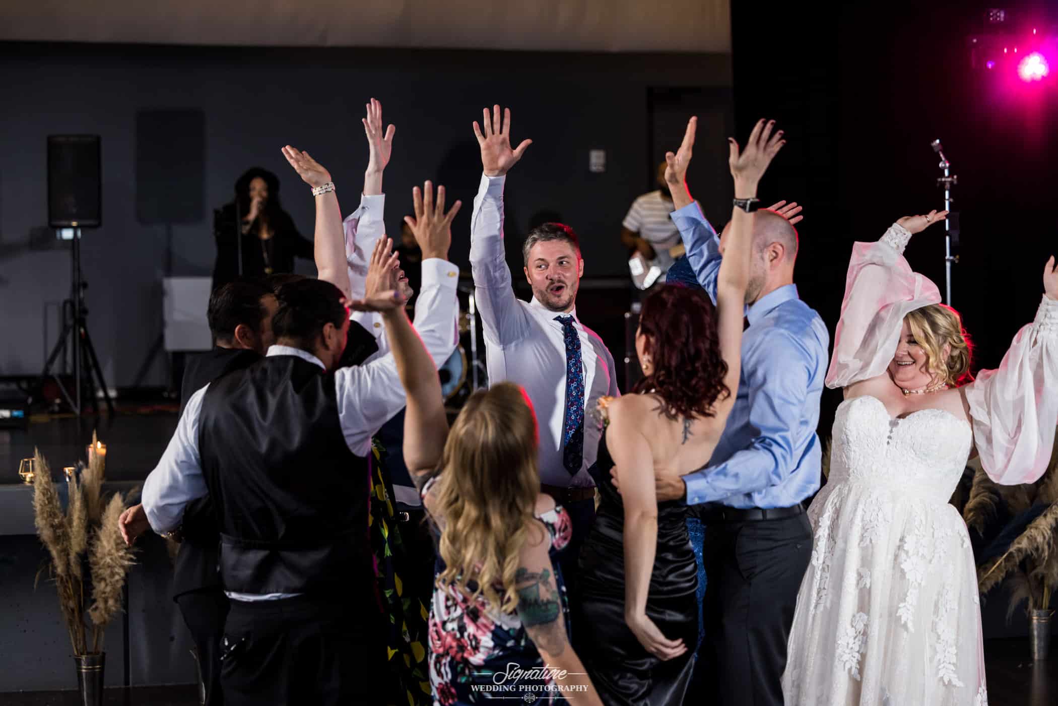 Bride dancing with wedding guests