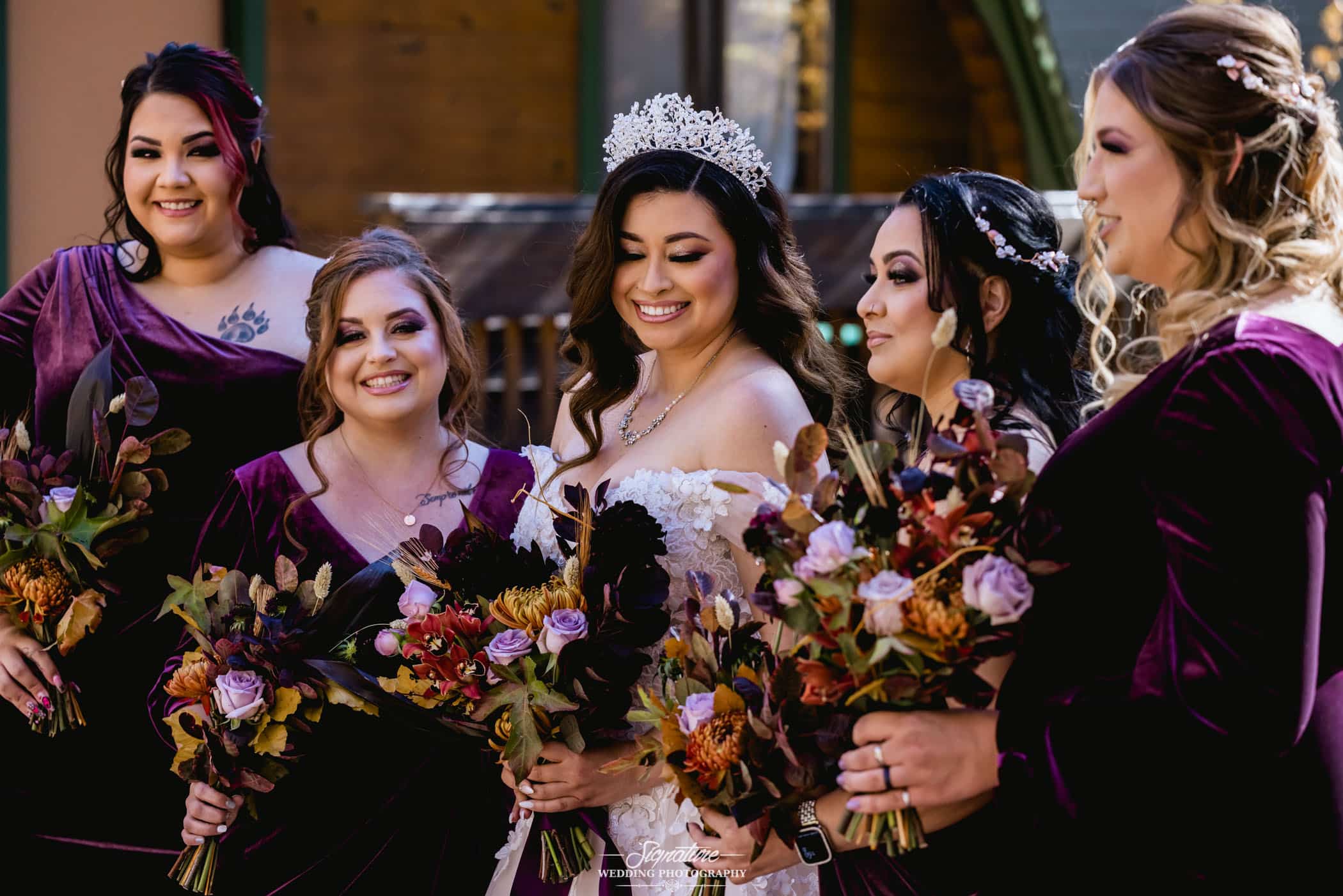 Bride and bridesmaids smiling