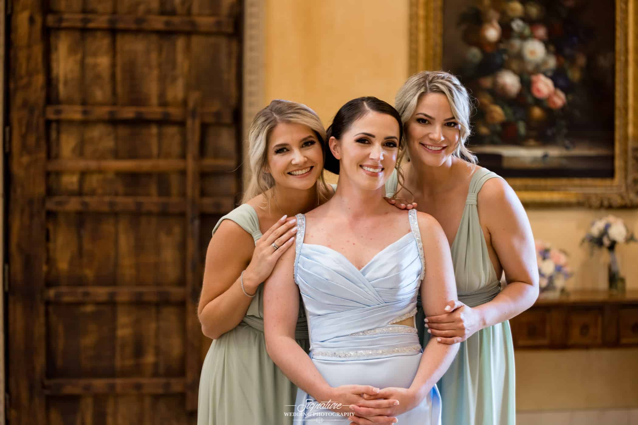 Bride and bridesmaids smiling