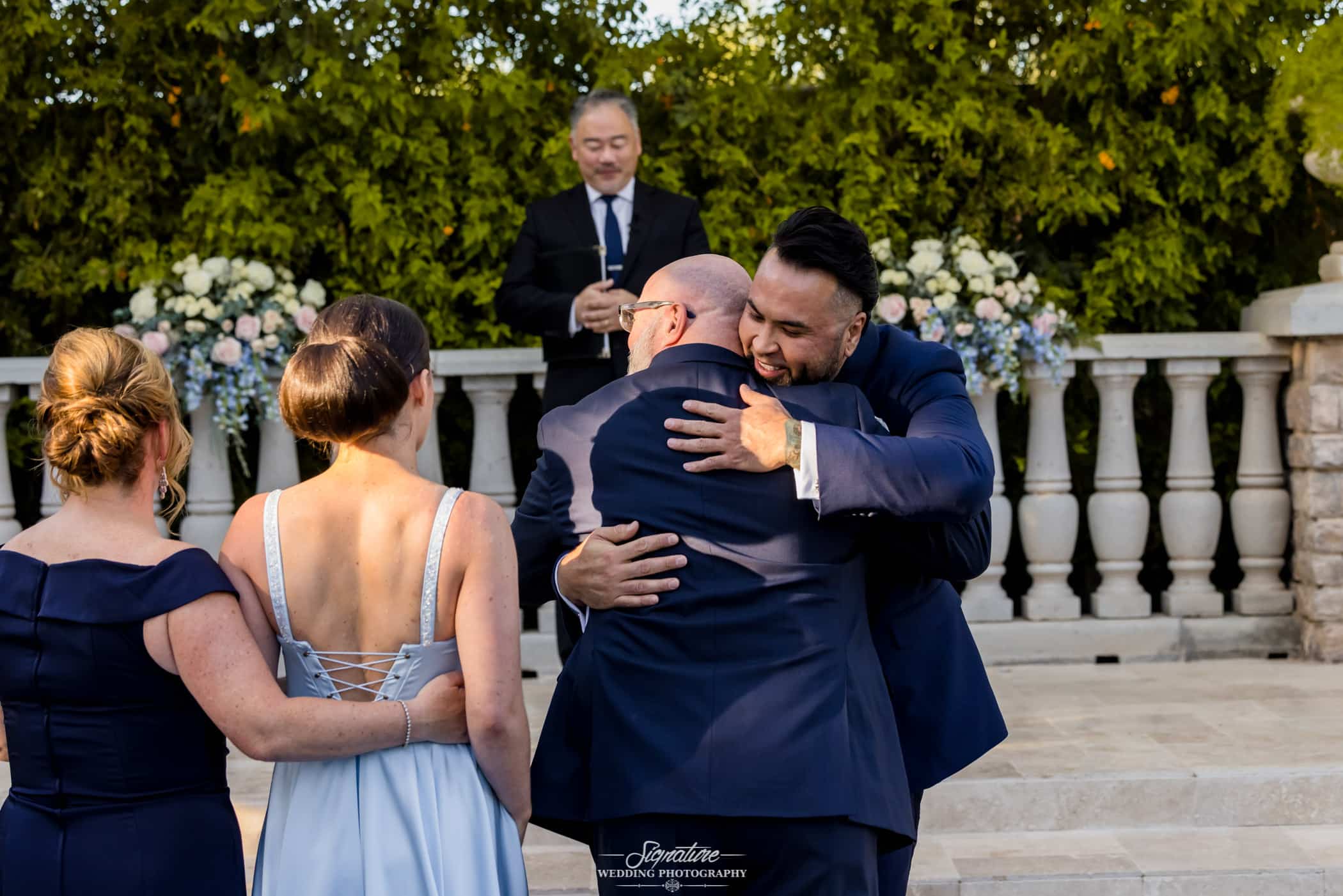Groom hugging father in law