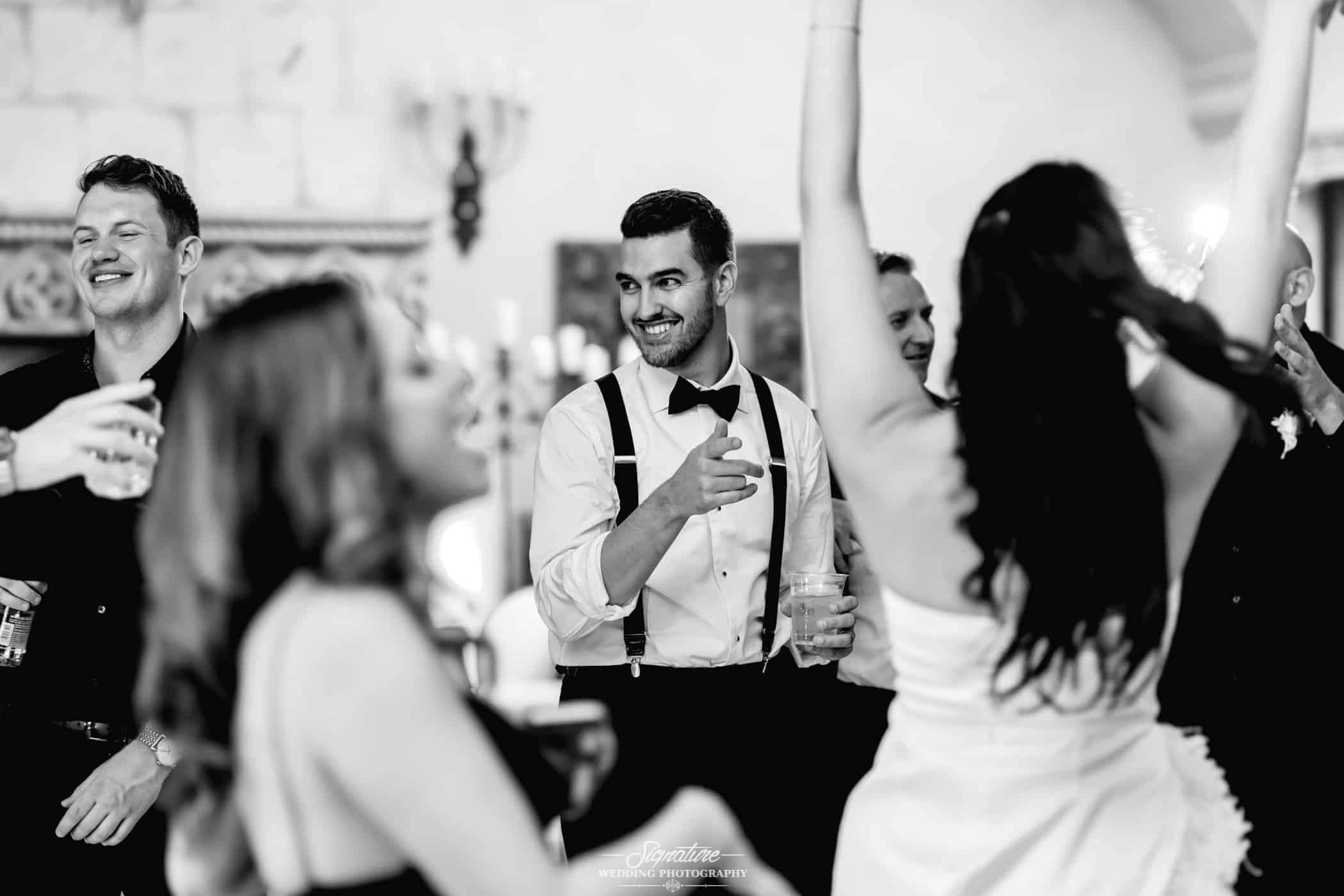 Wedding guests dancing black and white