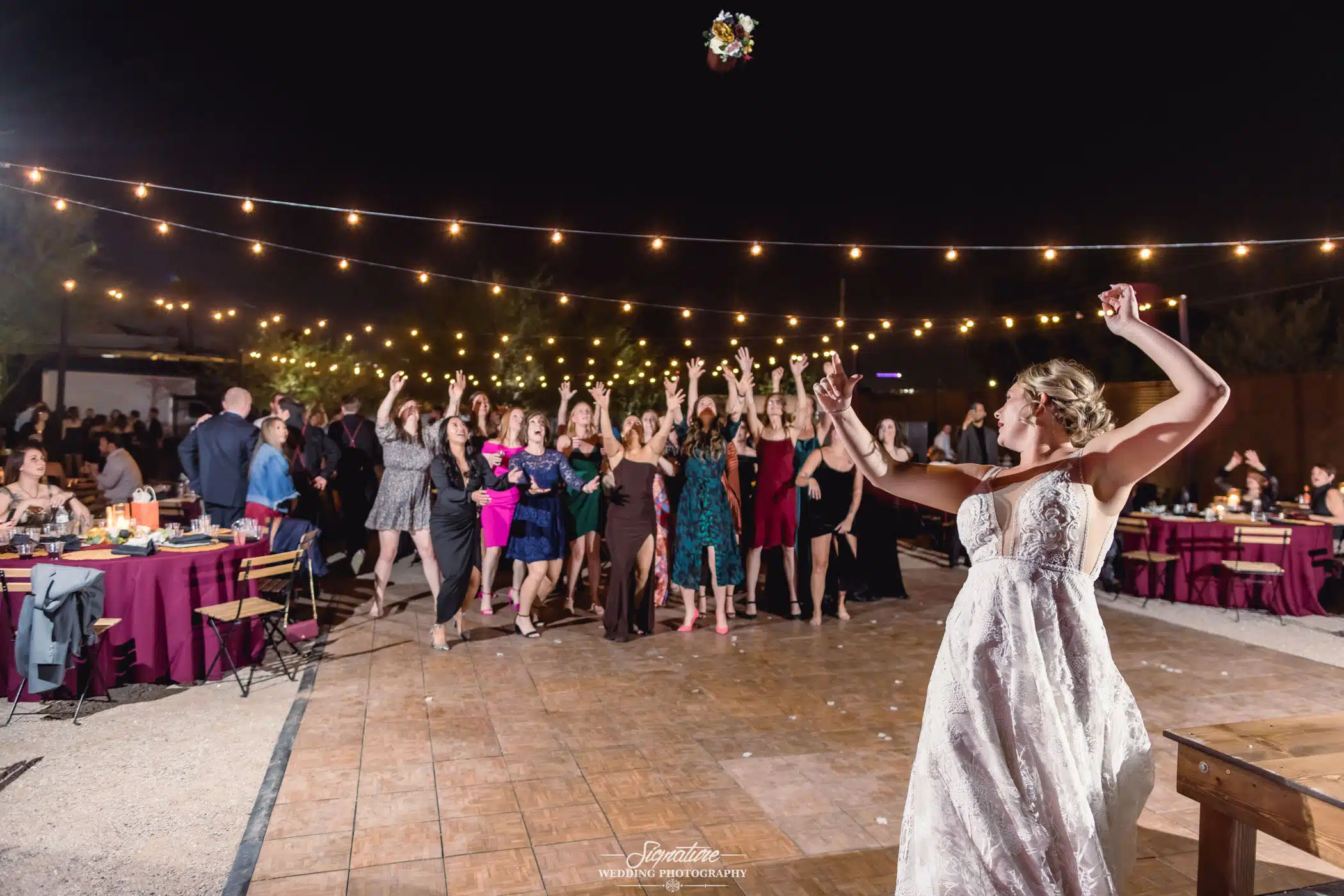 Bride doing bouquet toss