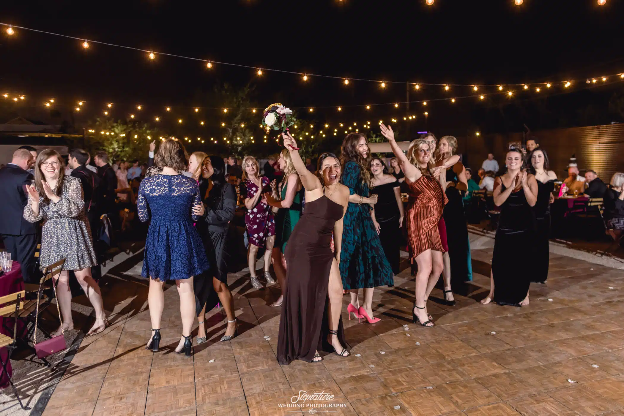 Wedding guest that caught the bouquet toss