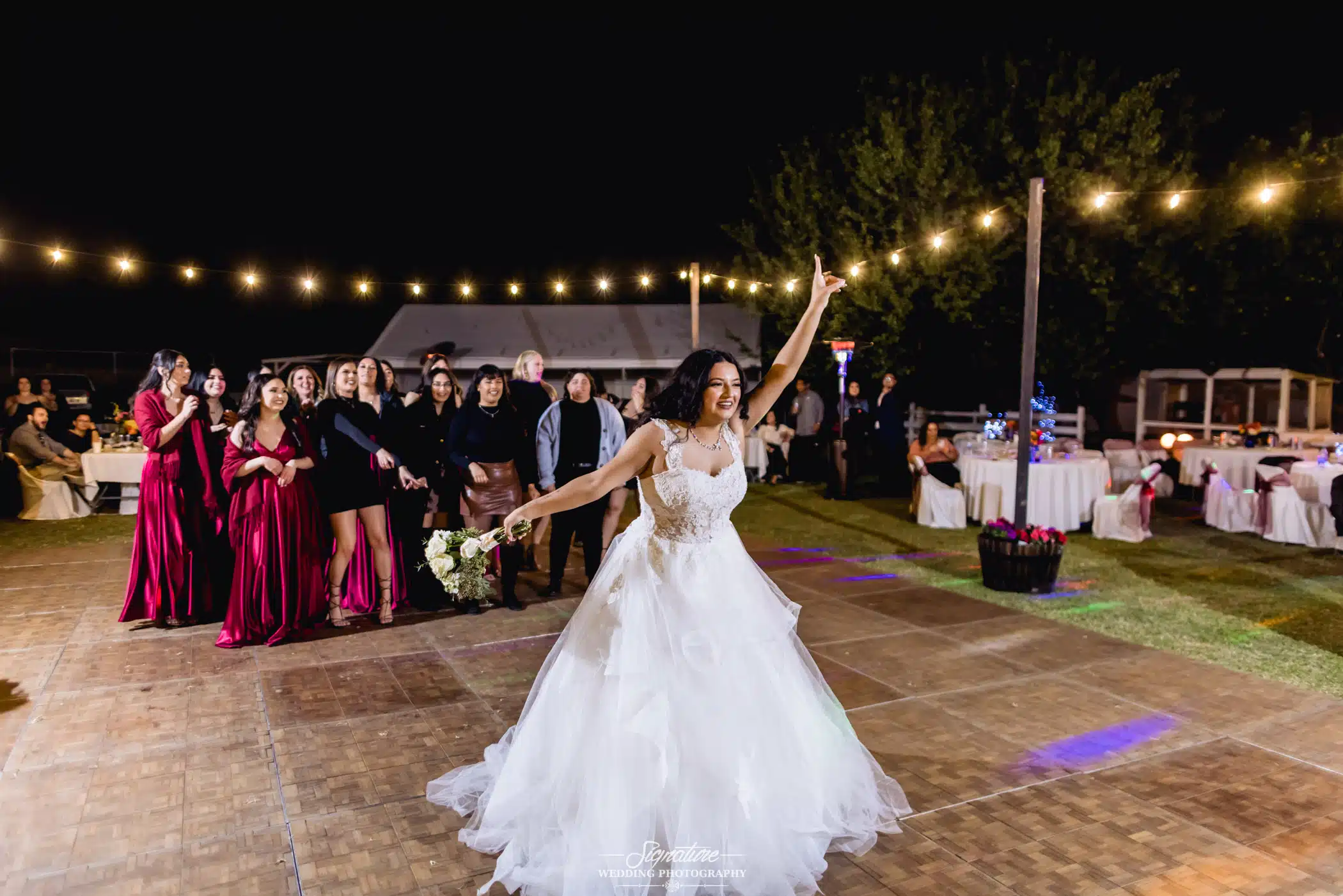 Bride doing bouquet toss
