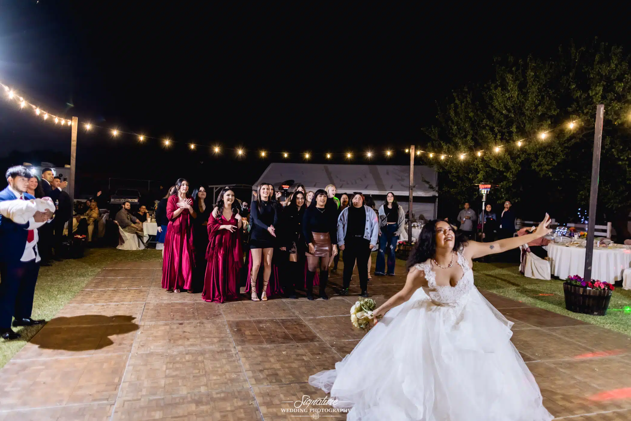 Bride doing bouquet toss