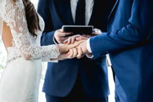 Couple holding hands during ceremony