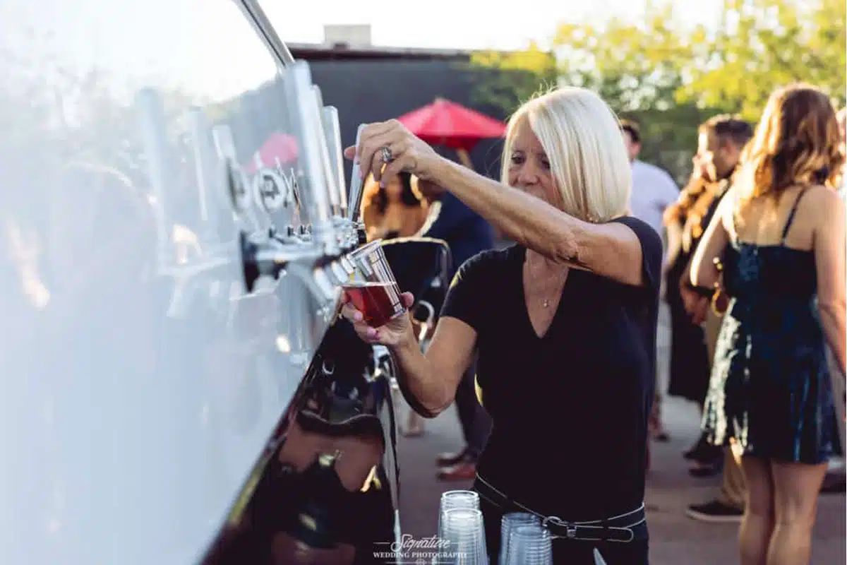 Bartender serving draft beer