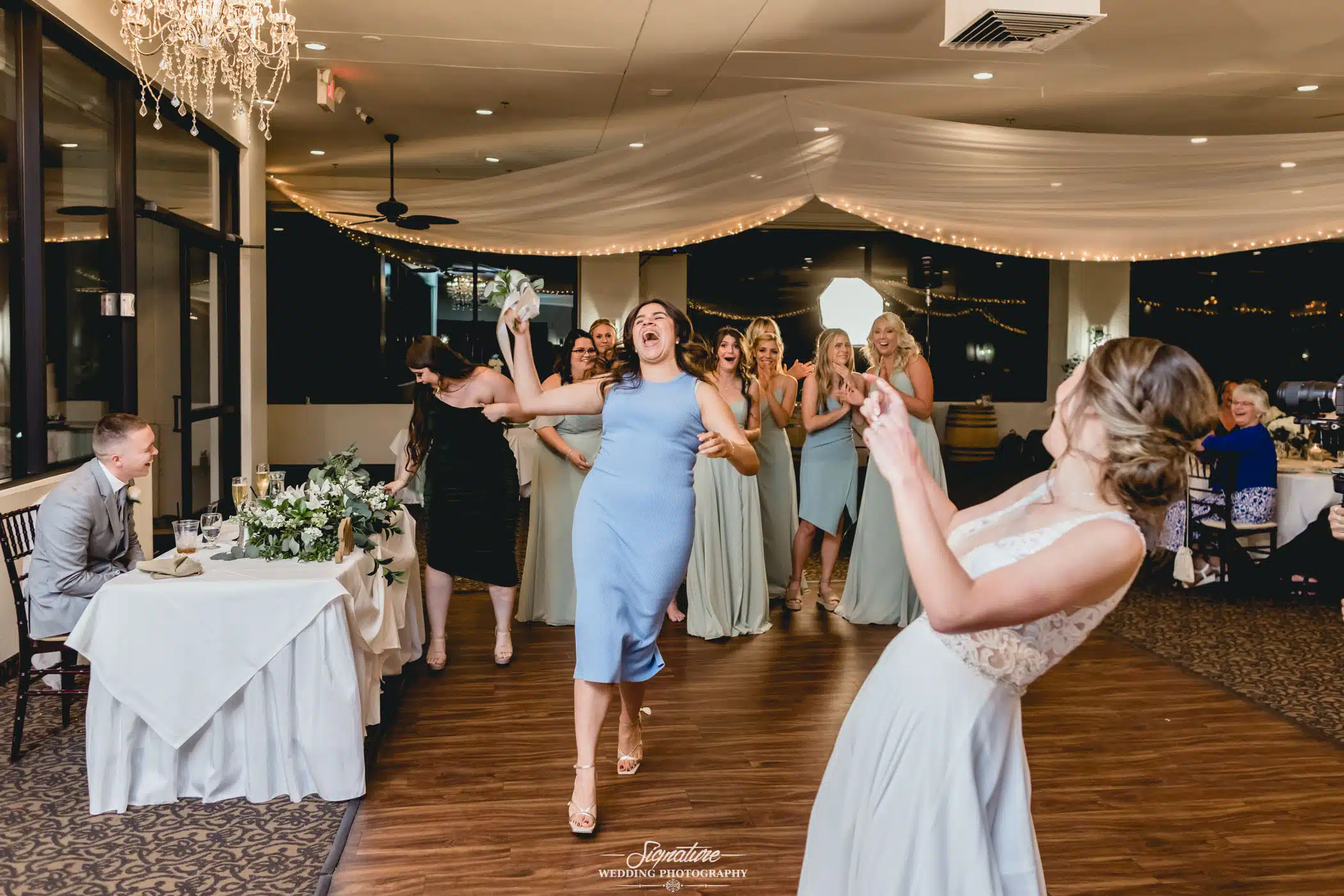 Image by Signature Wedding Photography Wedding guest that caught the bouquet
