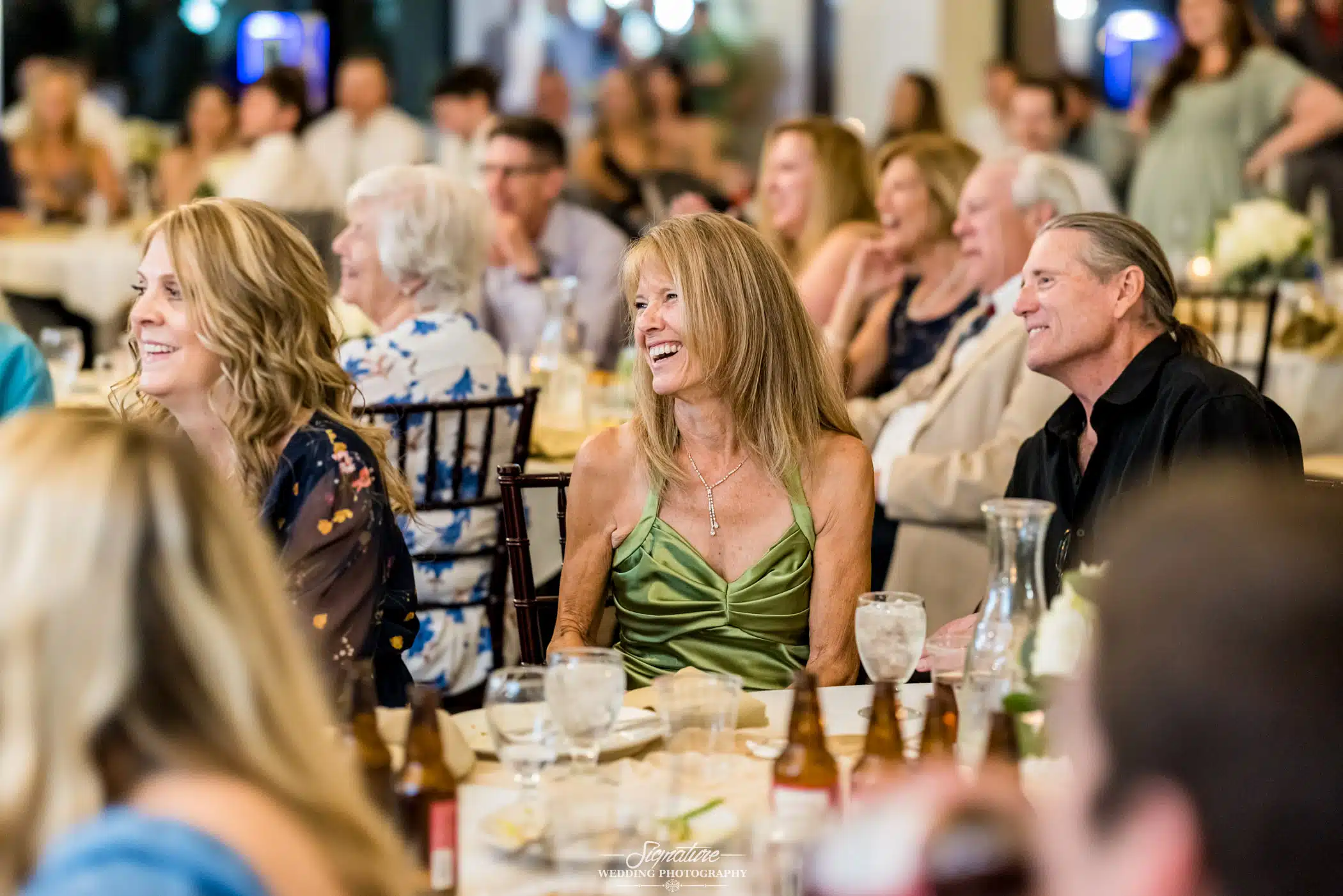 Image by Signature Wedding Photography Wedding guests smiling during reception