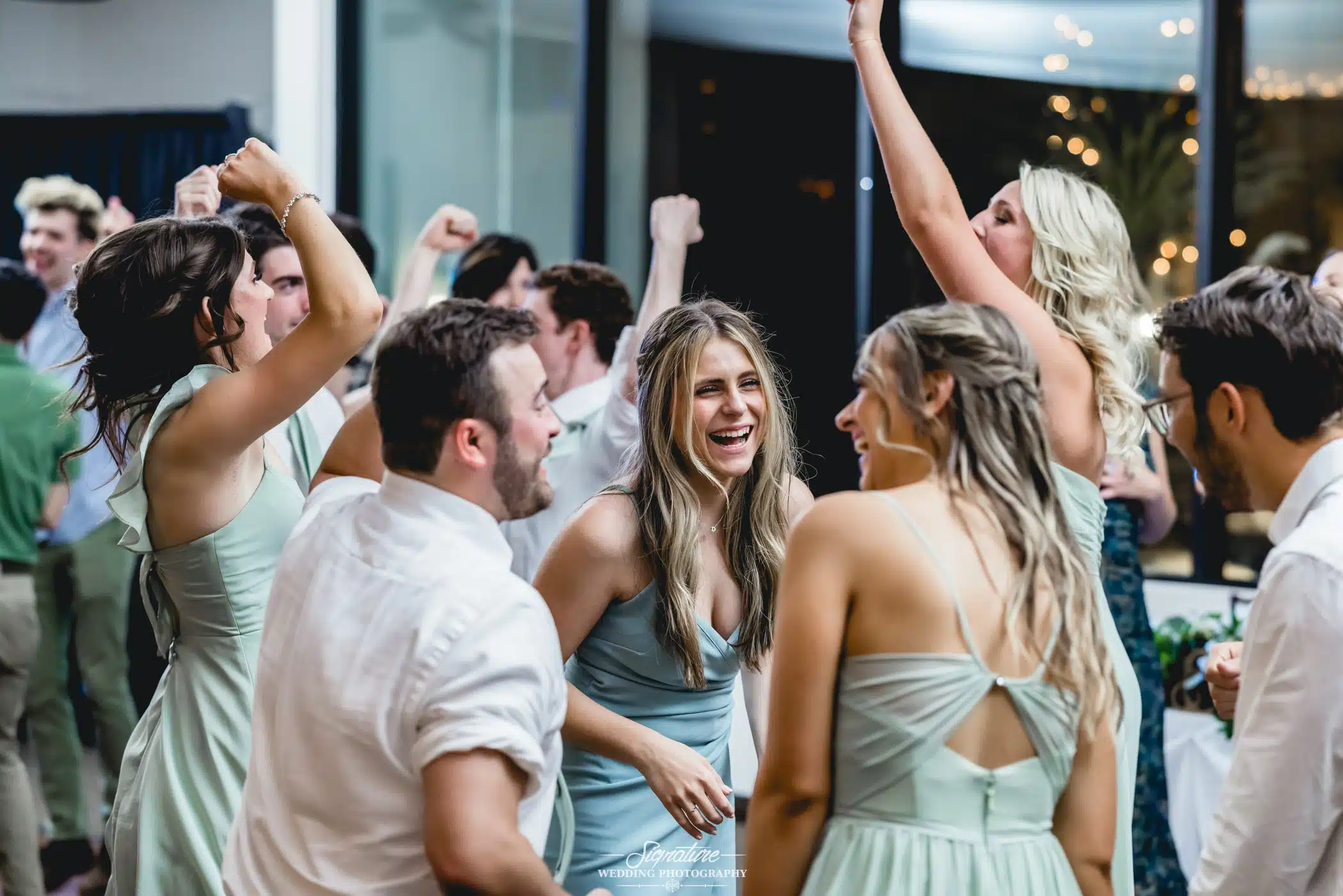 Image by Signature Wedding Photography Wedding guests laughing