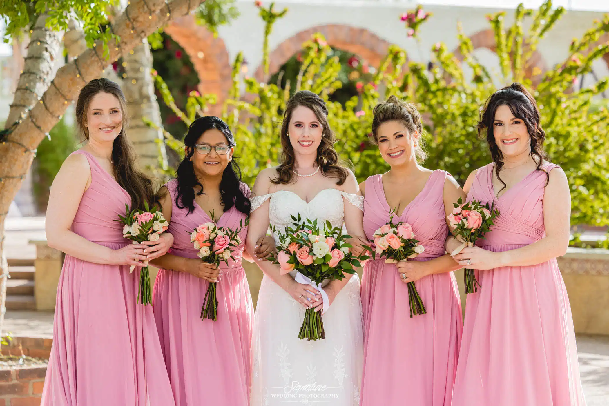 Image by Signature Wedding Photography Bride and bridesmaids smiling