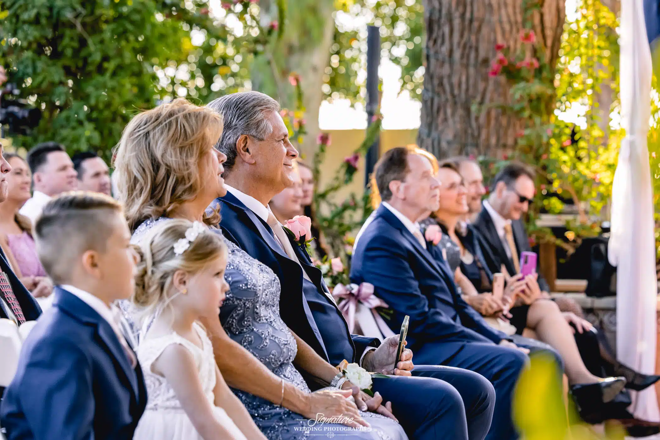 Image by Signature Wedding Photography Flower girl and ring bearer walking down aisle