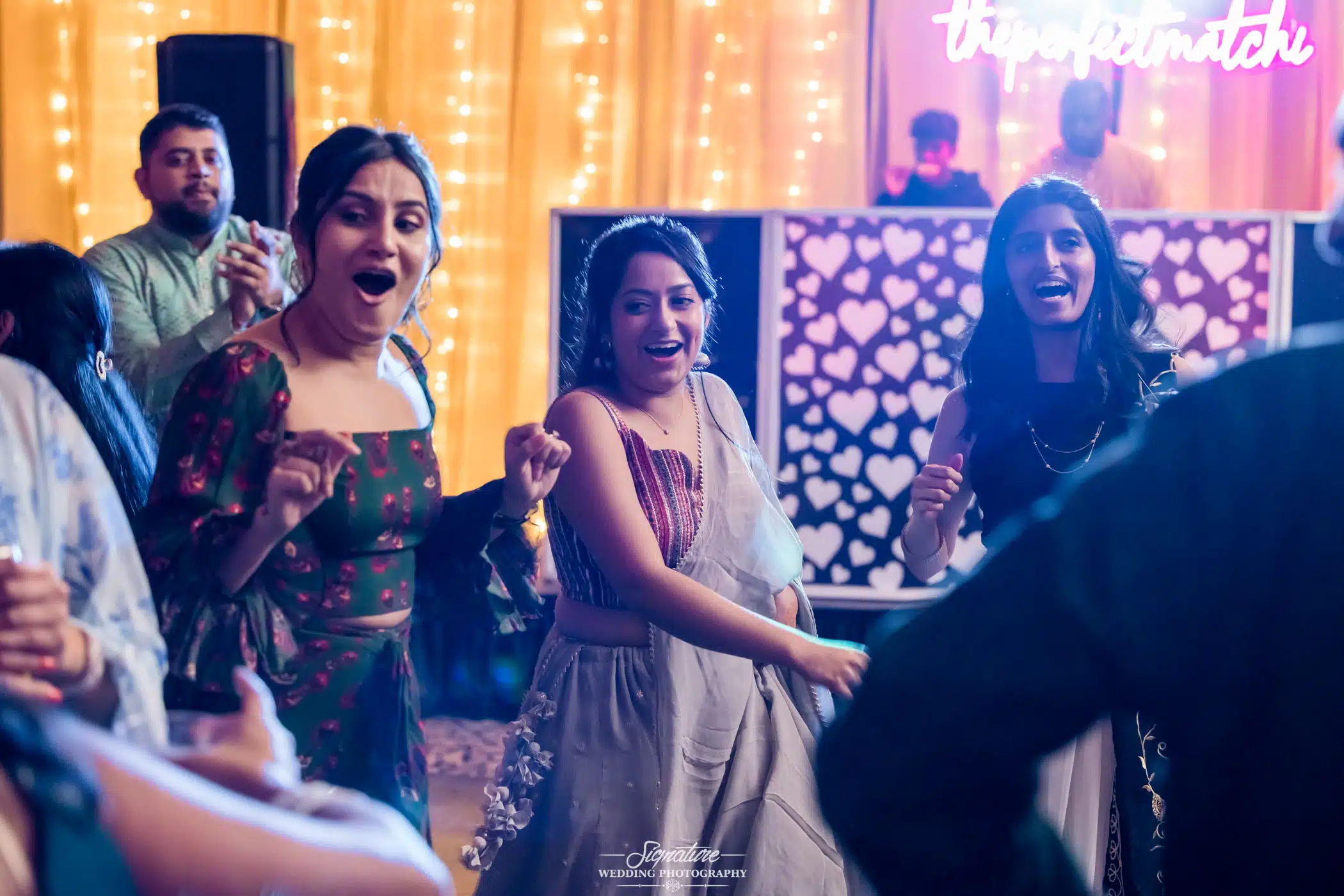 Image by Signature Wedding Photography Wedding guests laughing