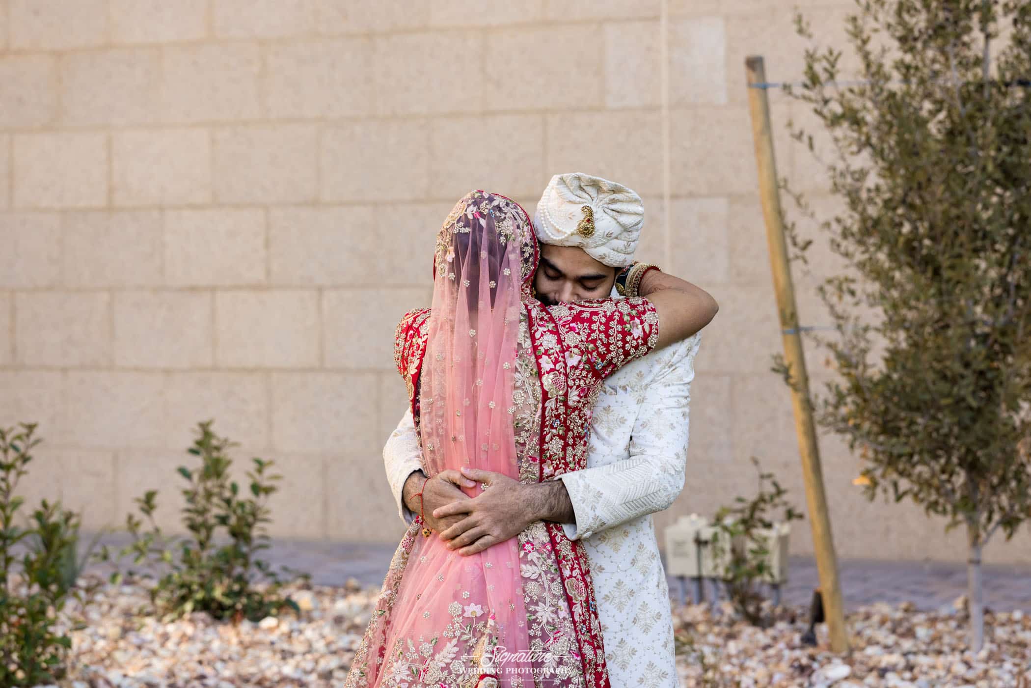 Bride and groom hugging for first look