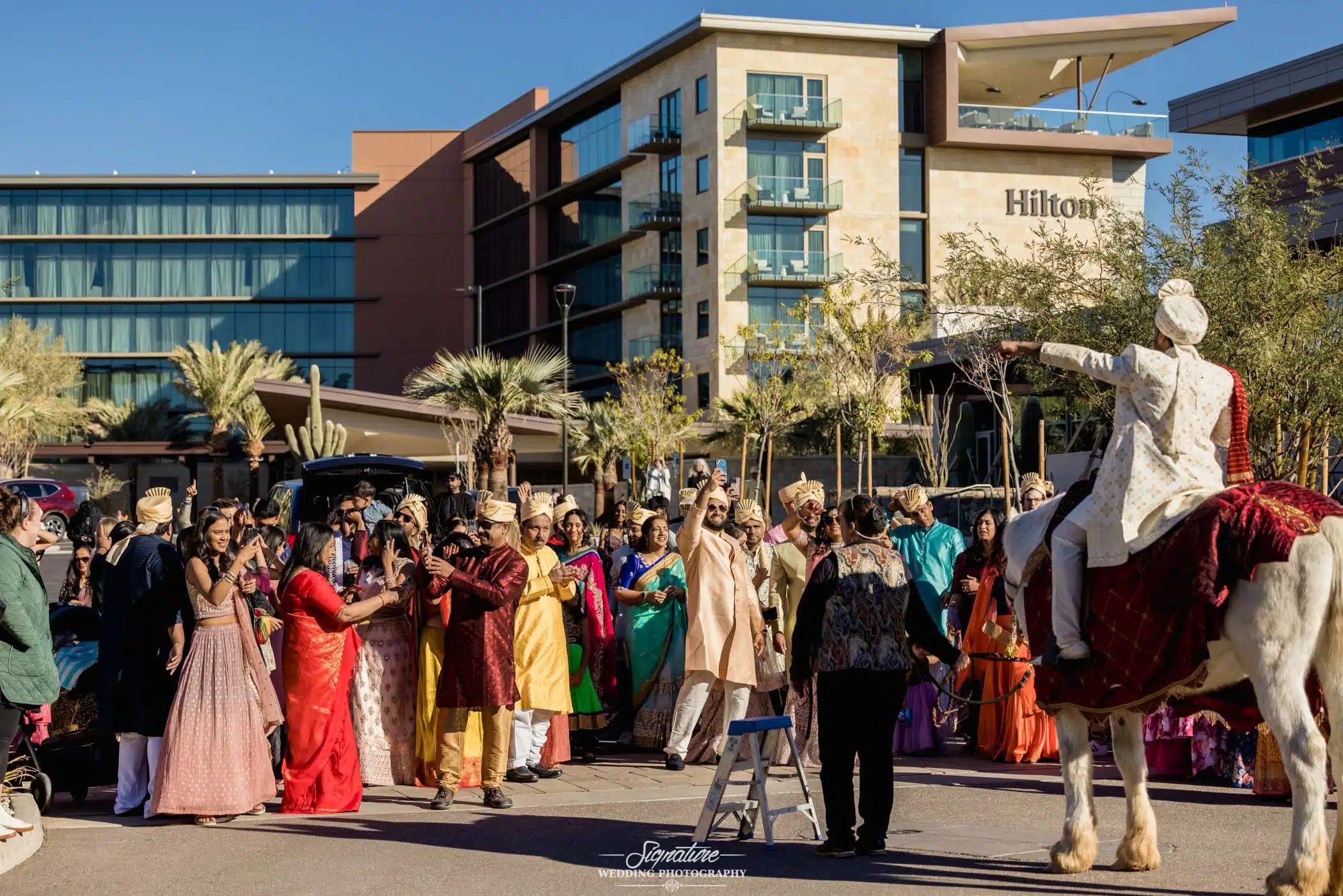 Image by Signature Wedding Photography Groom dancing with wedding guests