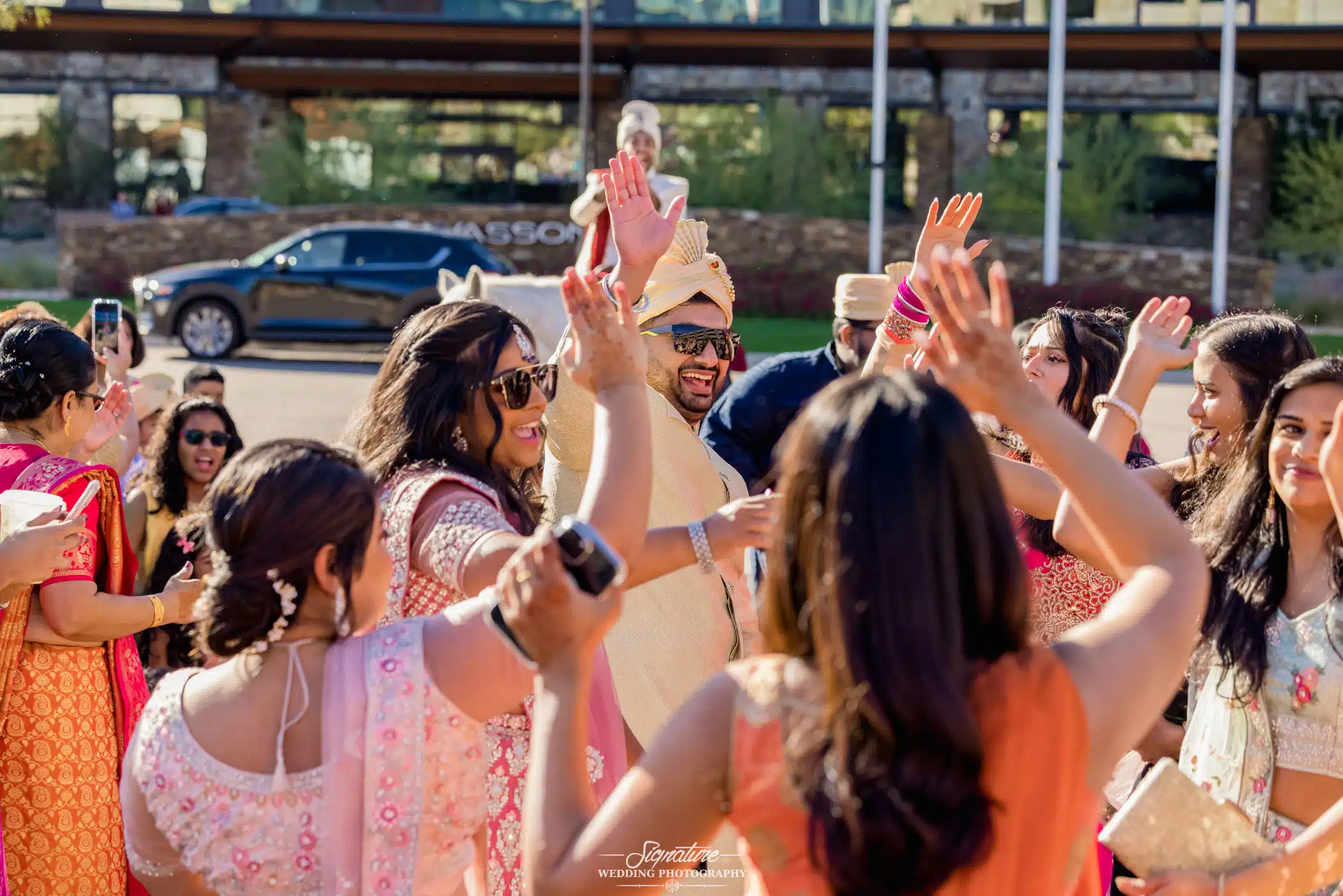 Image by Signature Wedding Photography Groom dancing with wedding guests