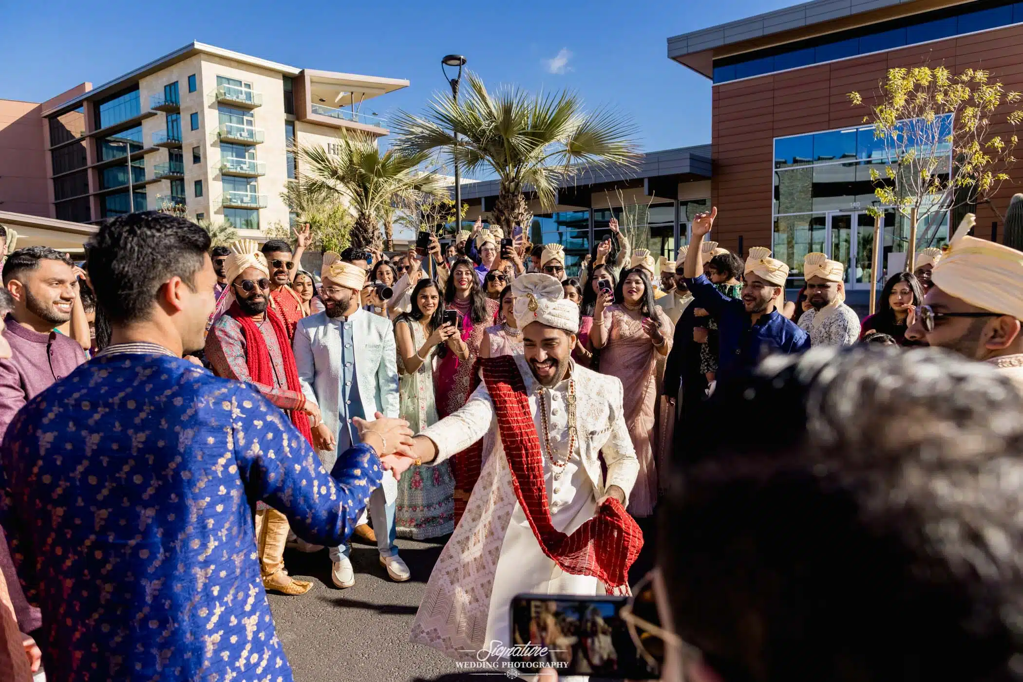 Image by Signature Wedding Photography Groom dancing with wedding guests