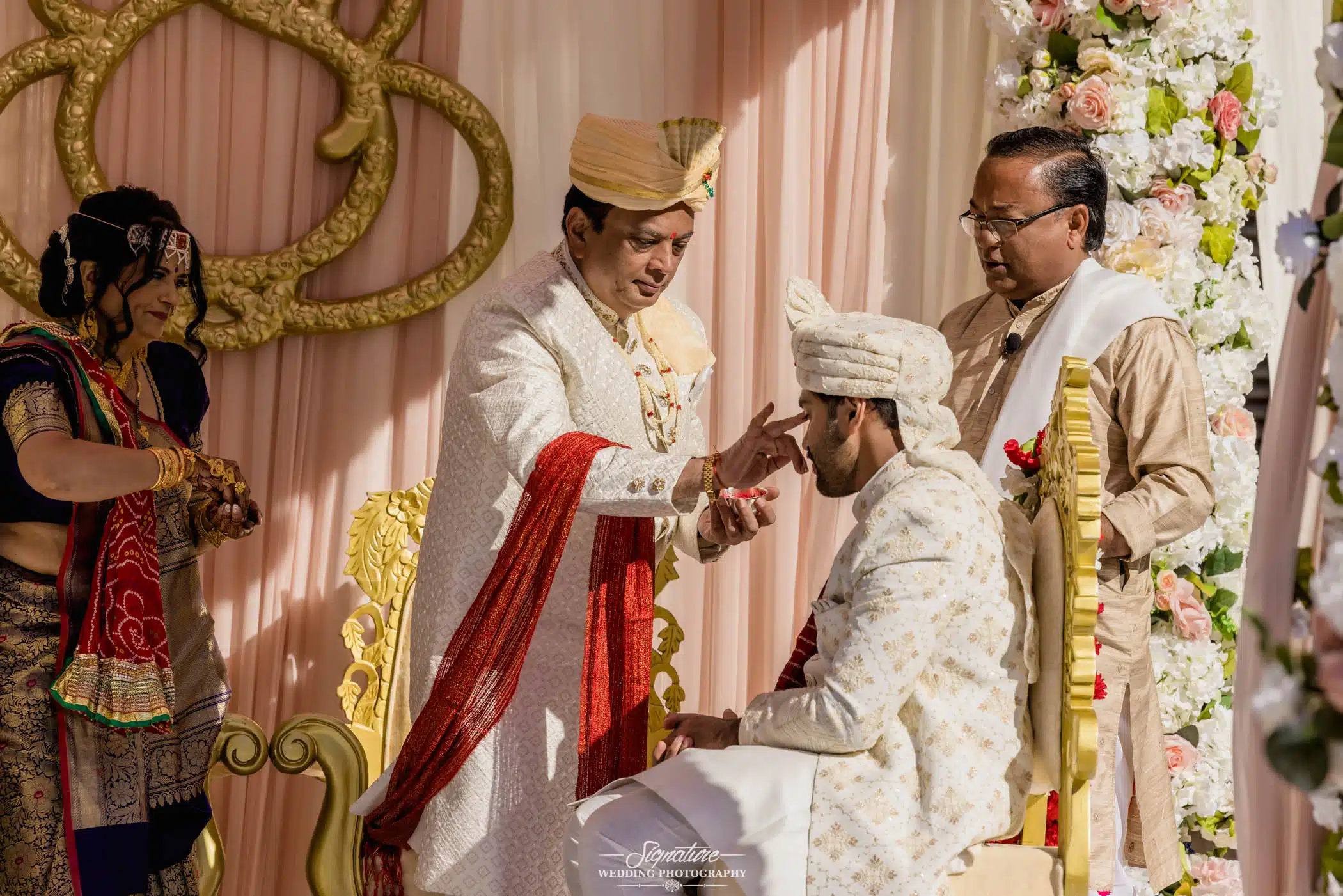 Image by Signature Wedding Photography Groom getting blessing