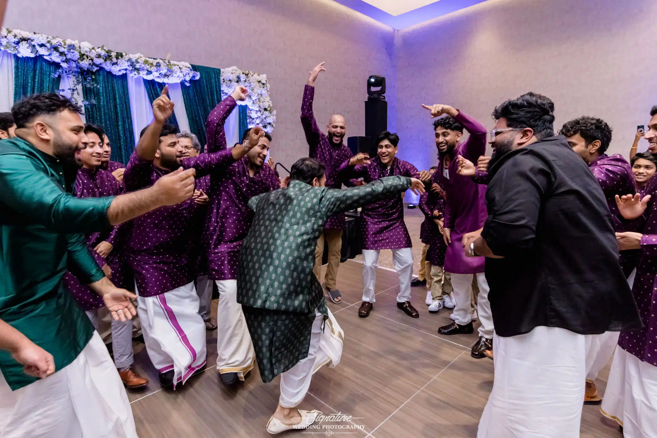 Image by Signature Wedding Photography Group dancing in circle