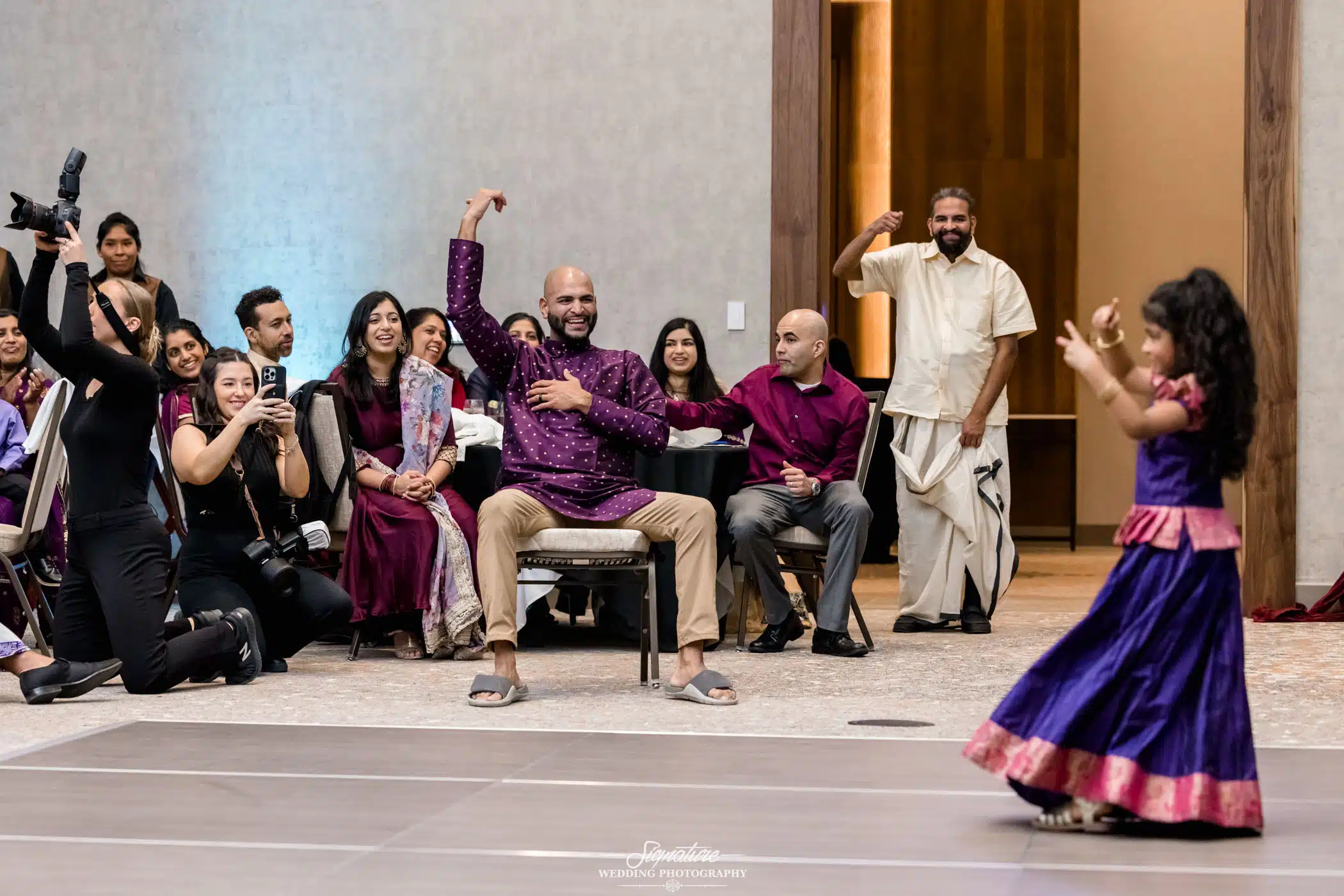 Image by Signature Wedding Photography Audience watching girl dance