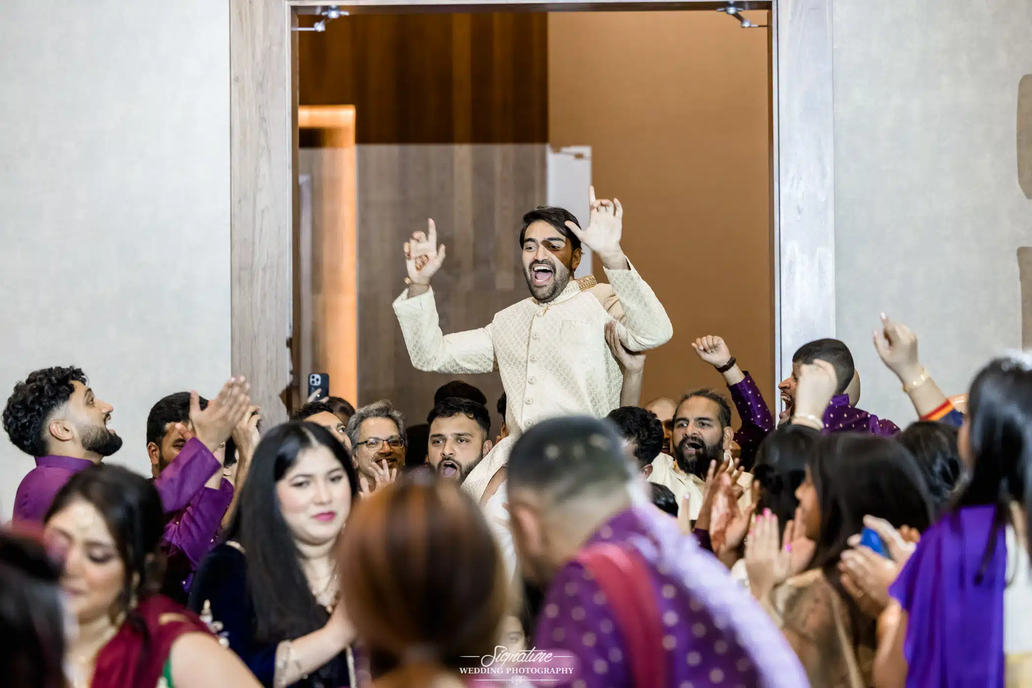 Image by Signature Wedding Photography Group picking groom up