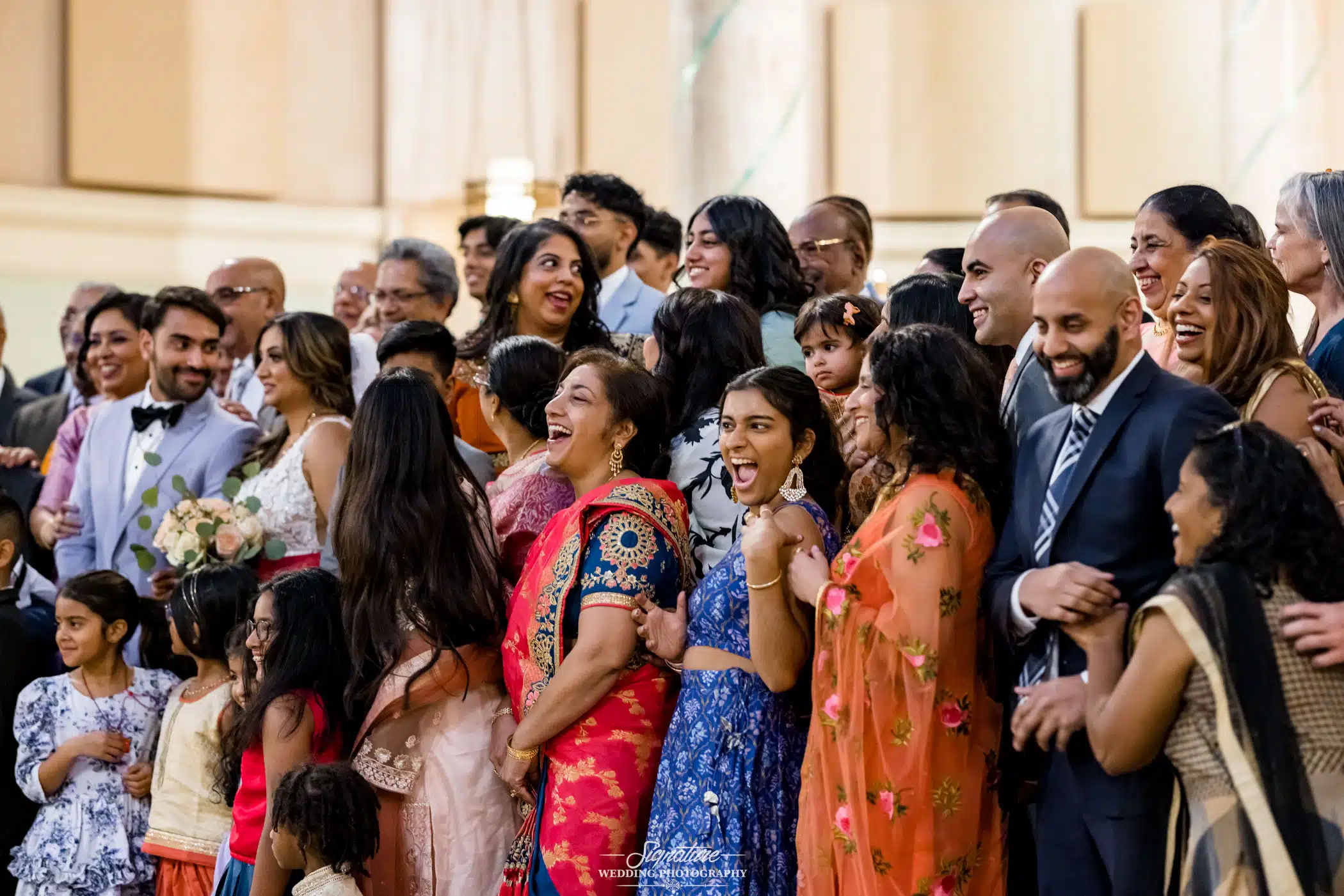 Image by Signature Wedding Photography Wedding guests smiling