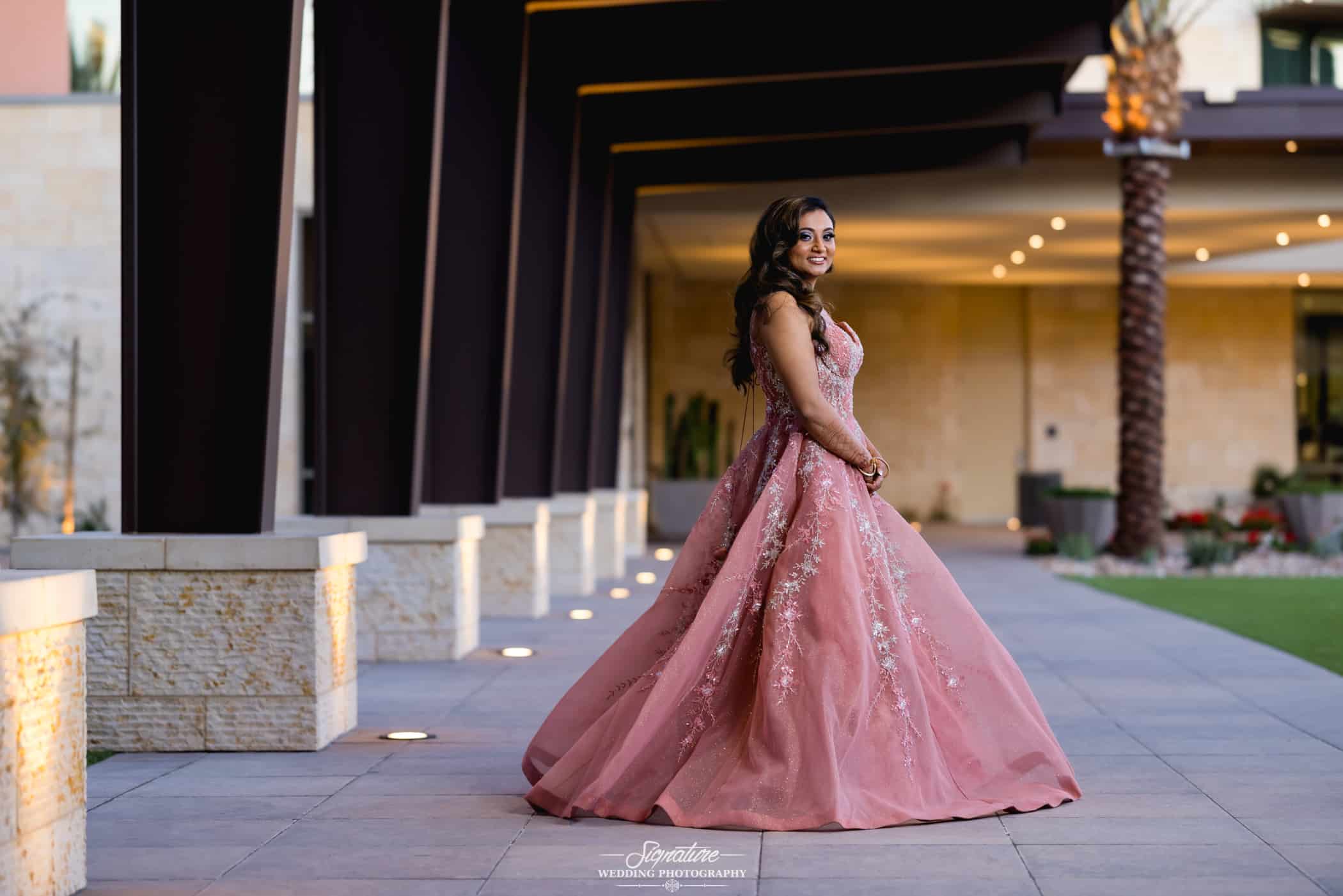 Bride with her full pink dress