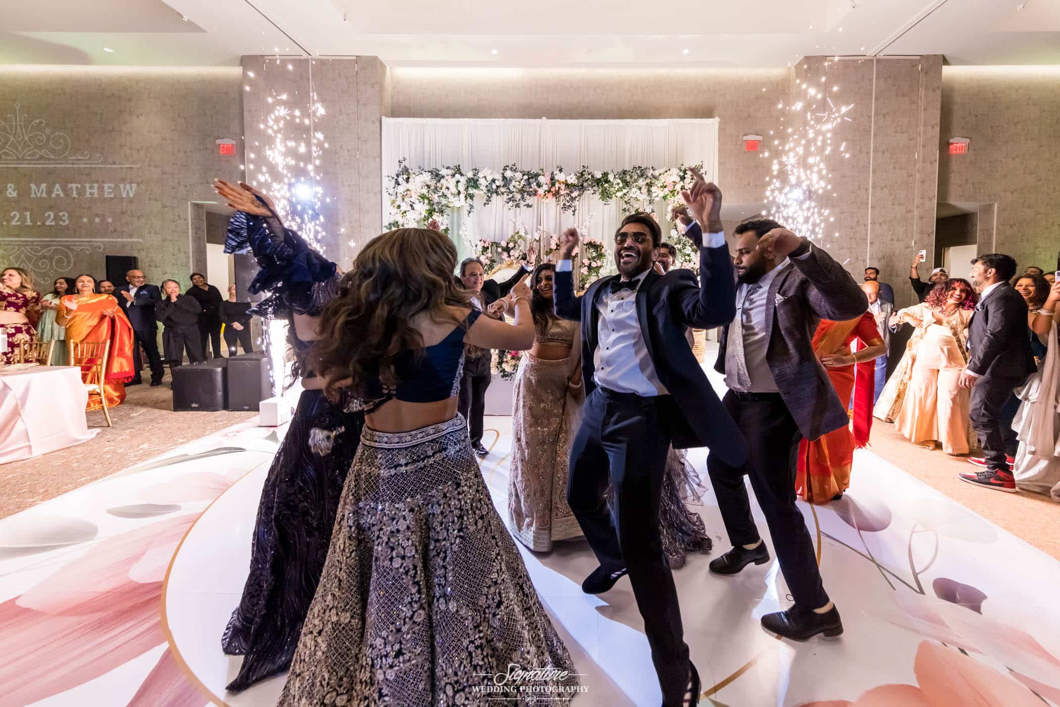 Bride and groom dancing with wedding guests