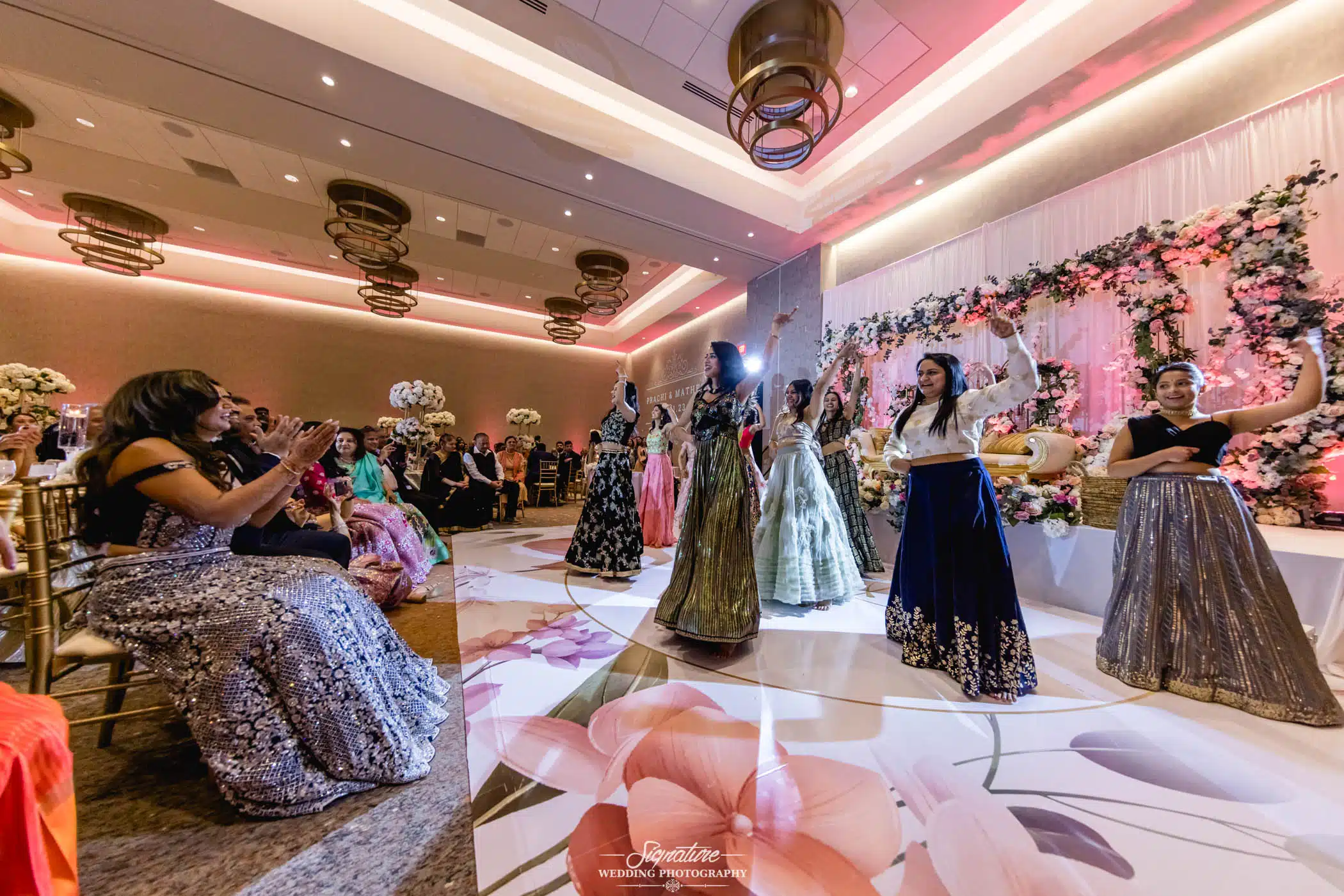 Image by Signature Wedding Photography Wedding guests dancing for bride and groom