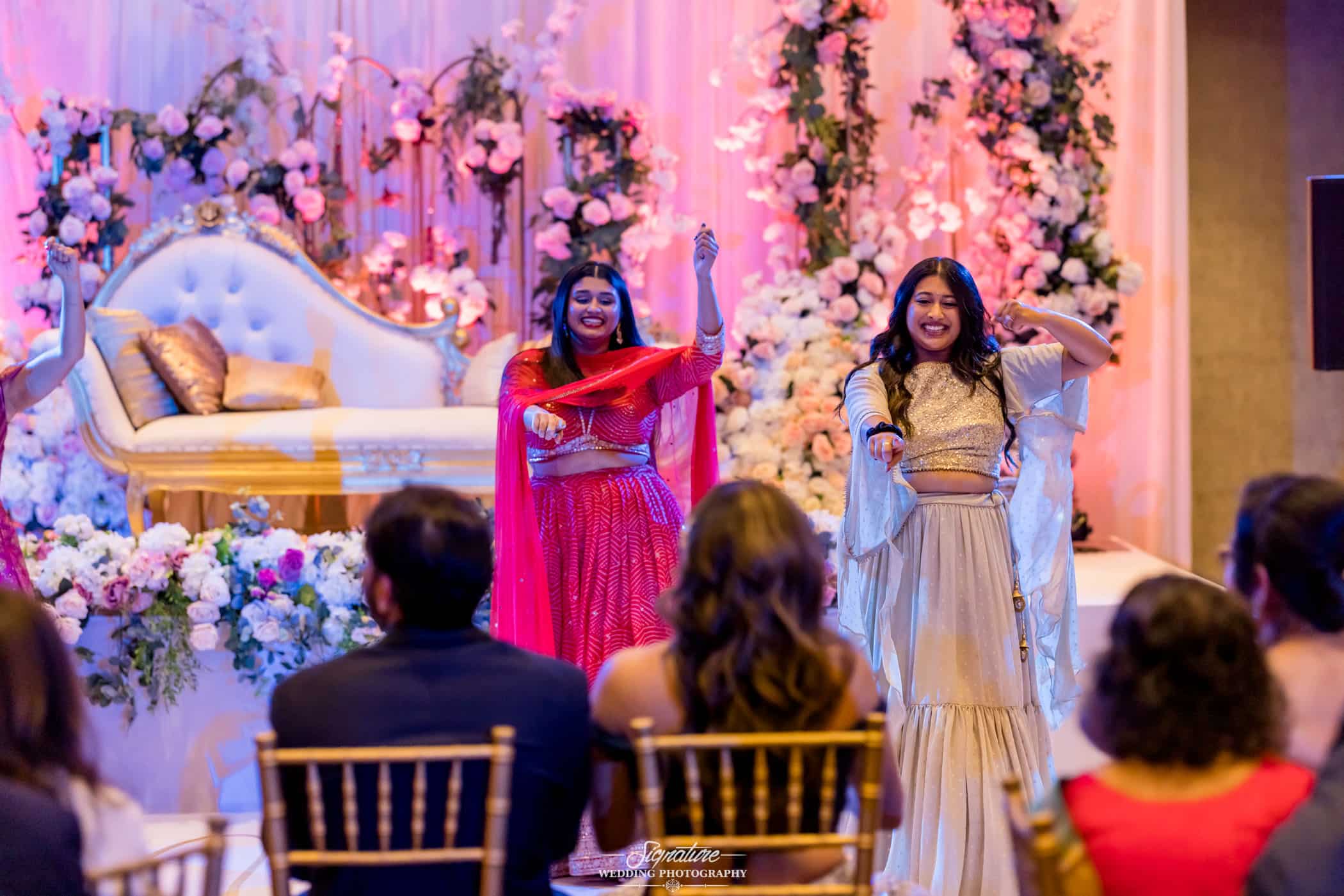 Wedding guests dancing for bride and groom