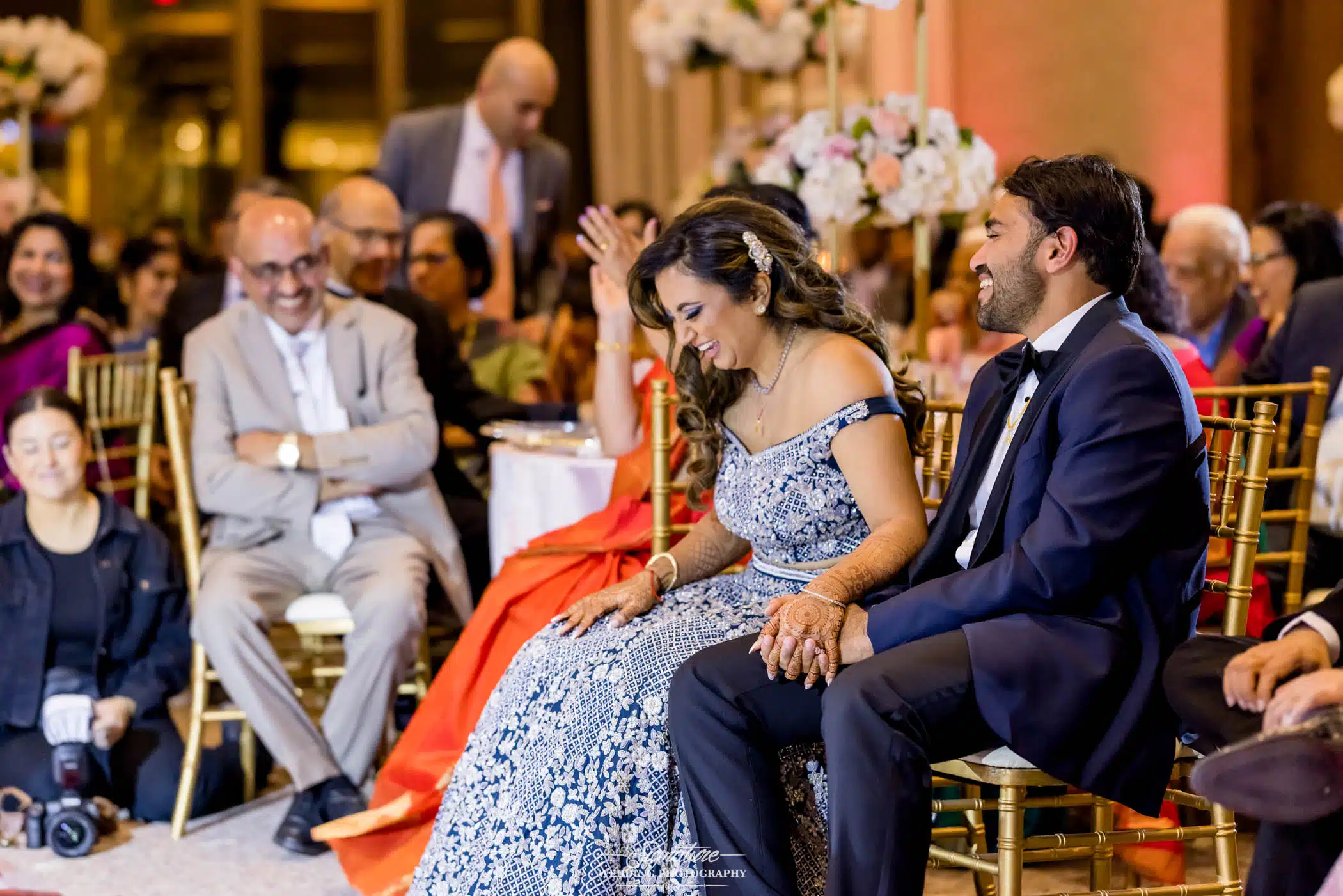 Image by Signature Wedding Photography Bride and groom sitting smiling