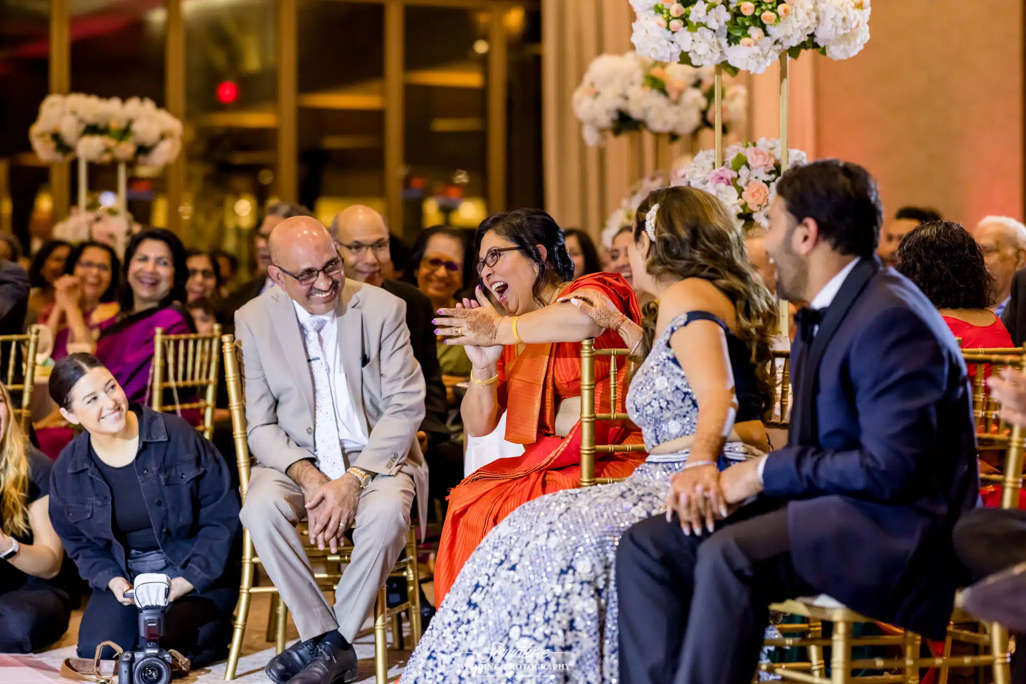 Image by Signature Wedding Photography Bride and groom sitting smiling