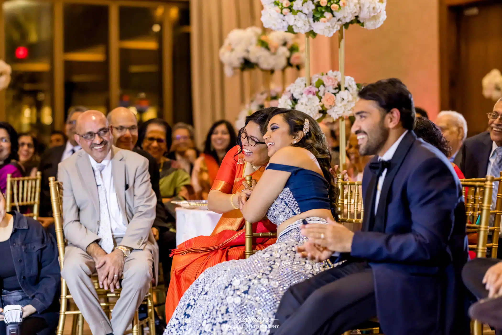 Image by Signature Wedding Photography Bride and groom sitting smiling