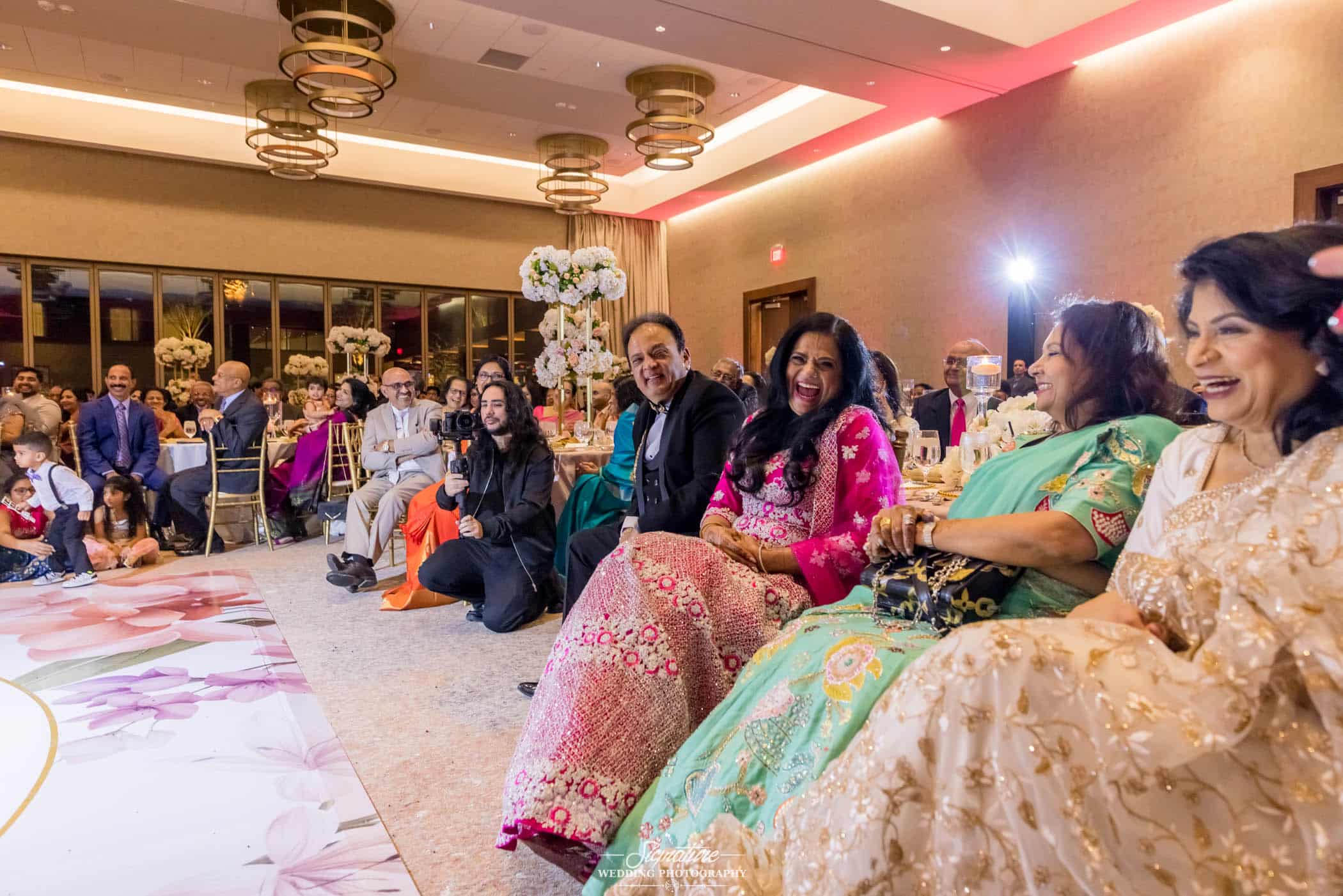 Wedding guests sitting during reception