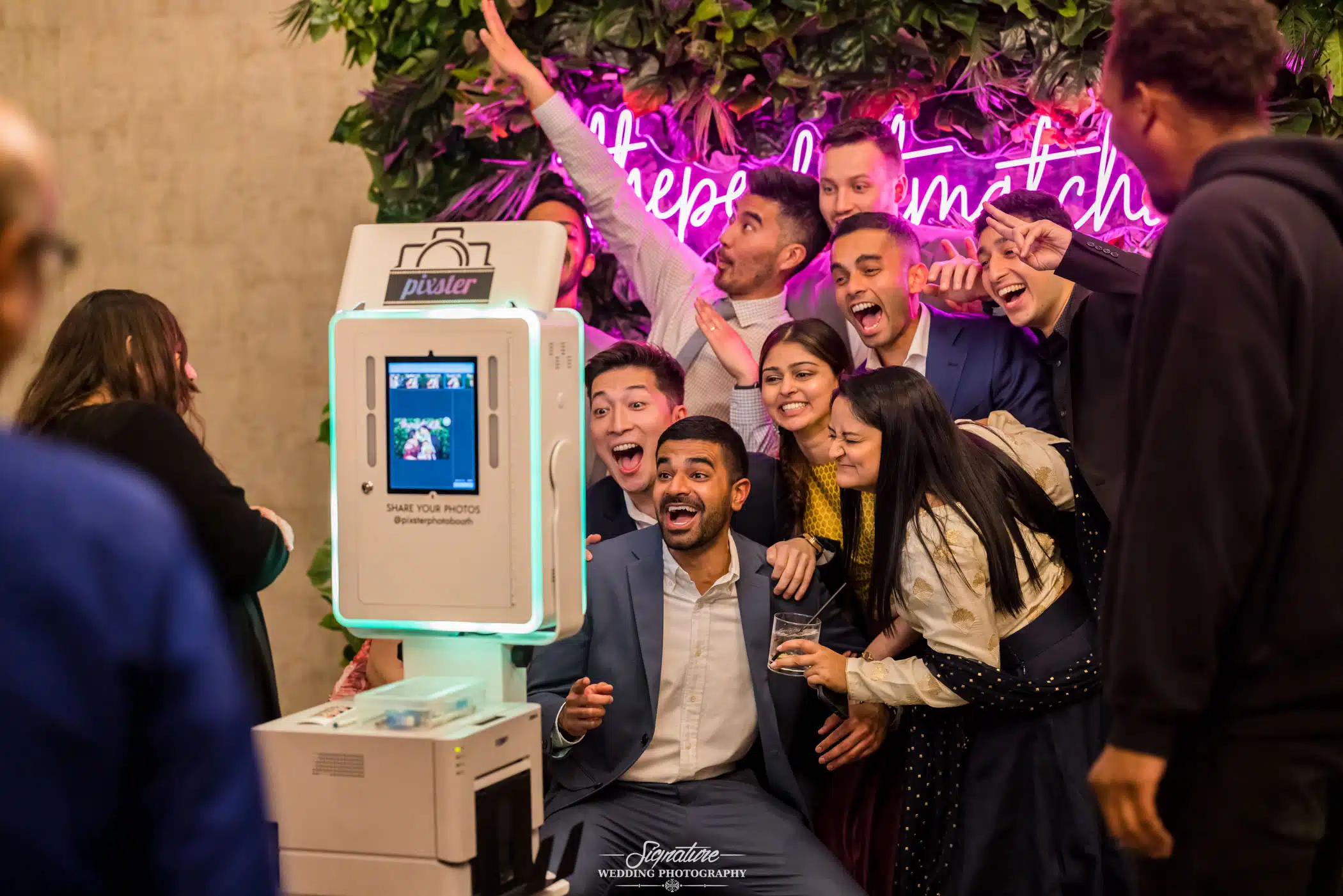Image by Signature Wedding Photography Group photo at photo booth