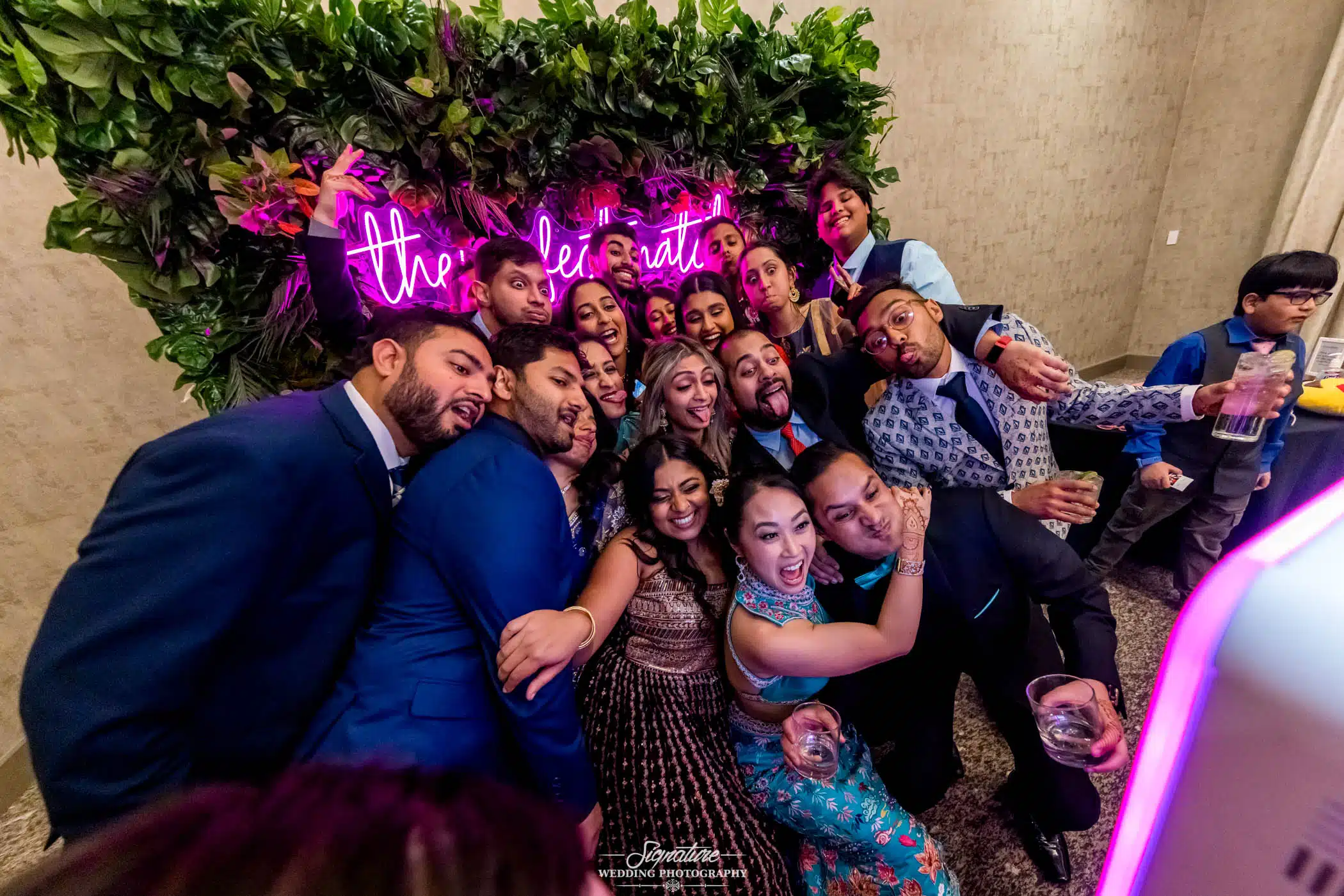 Image by Signature Wedding Photography Group photo at photo booth