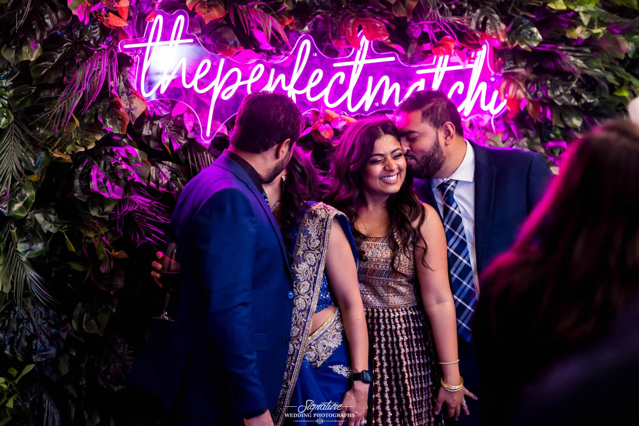 Image by Signature Wedding Photography Bride and groom posing with couple