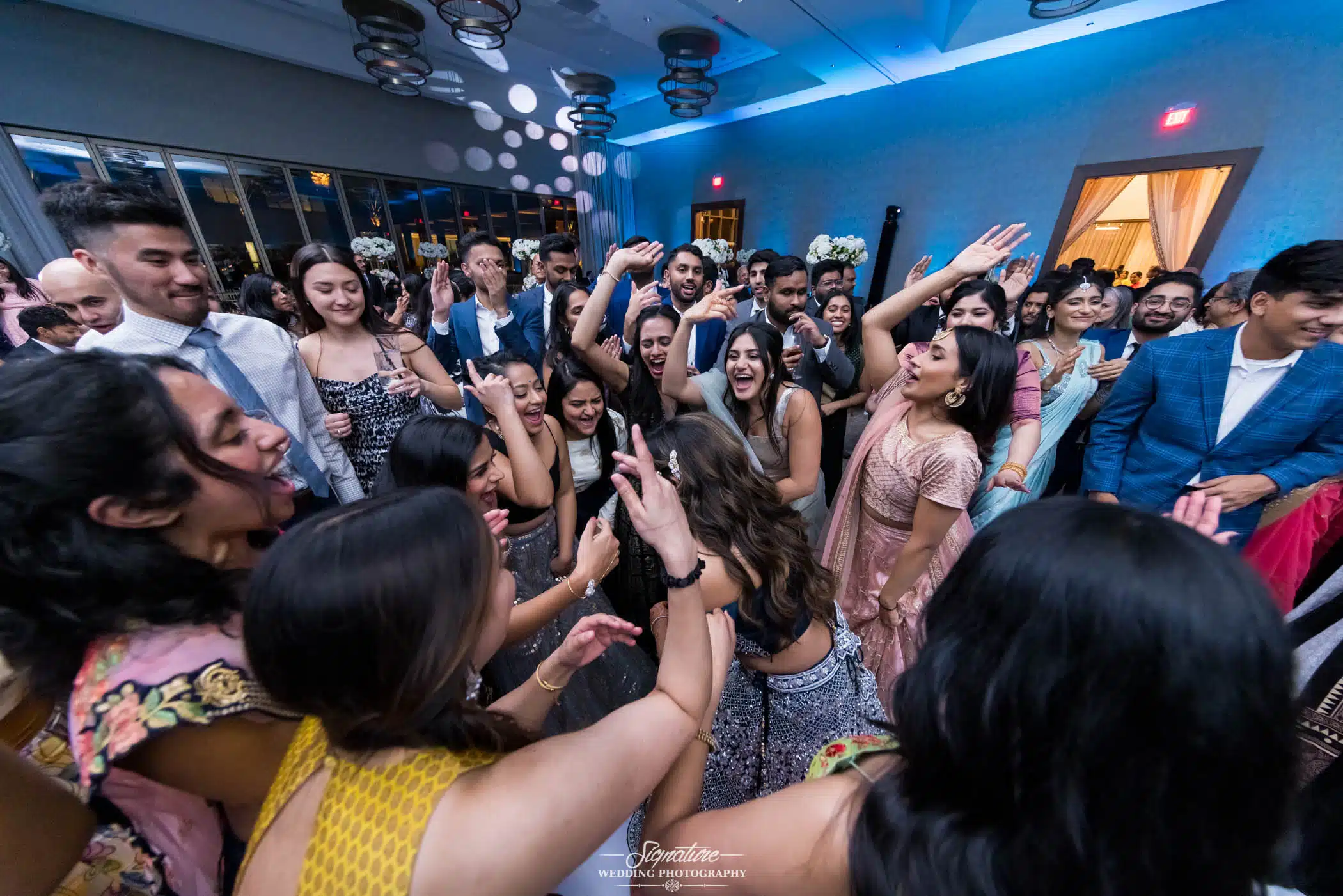 Image by Signature Wedding Photography Wedding guests dancing in circle