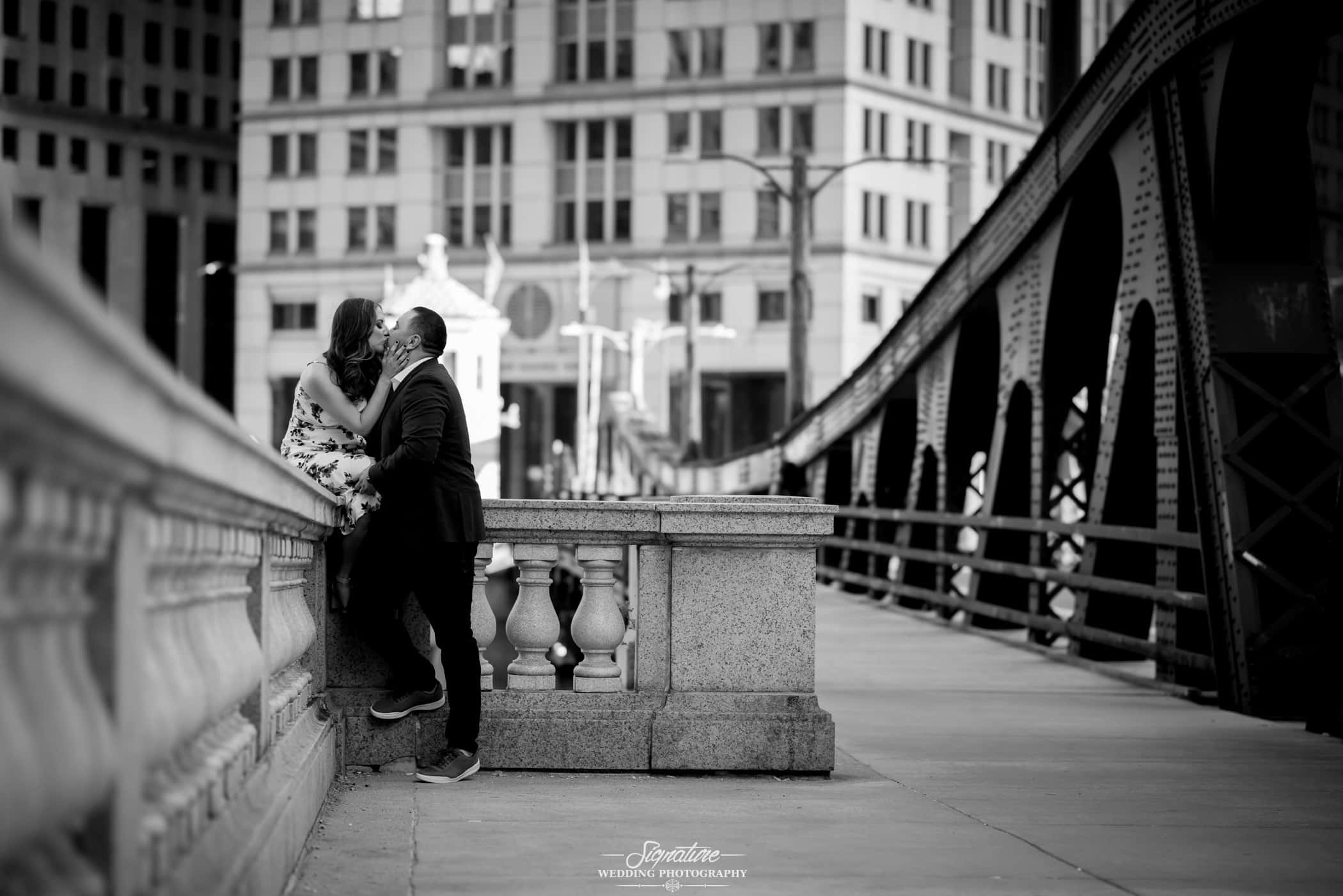 black and white engagement photo of a couple kissing in chicago