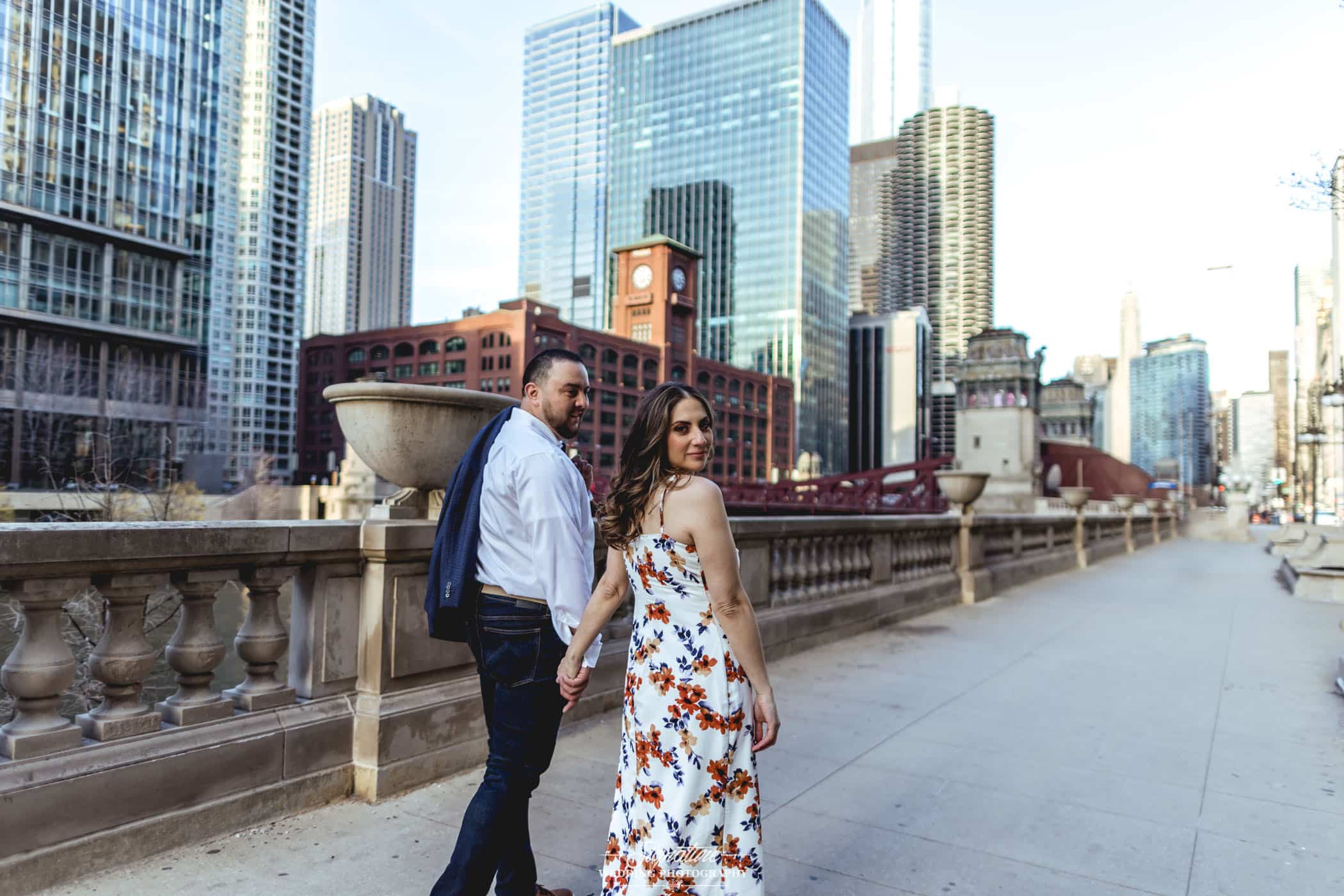 engagement photo of couple with skyscrapers in the background