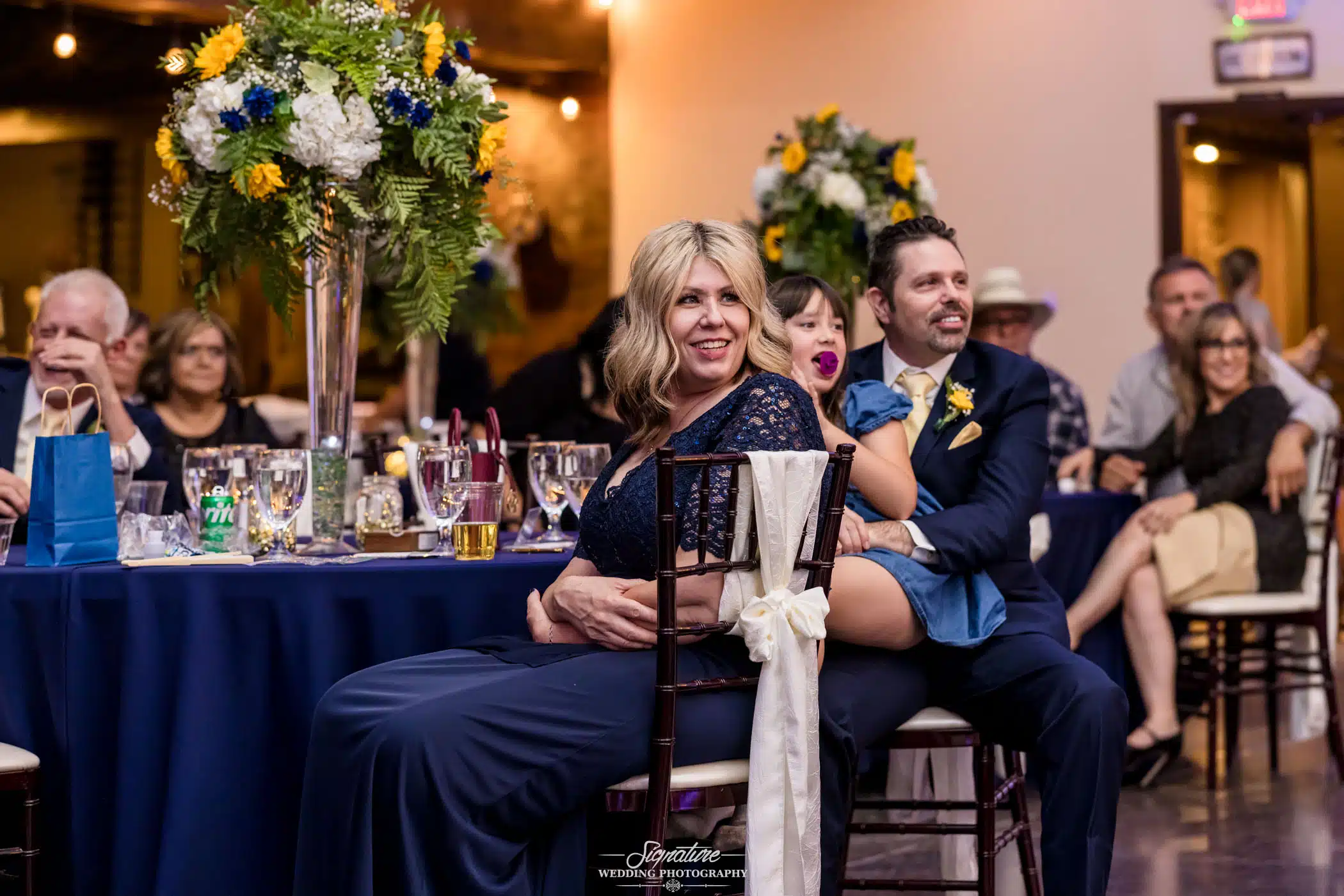 Image by Signature Wedding Photography guest of the wedding looking on