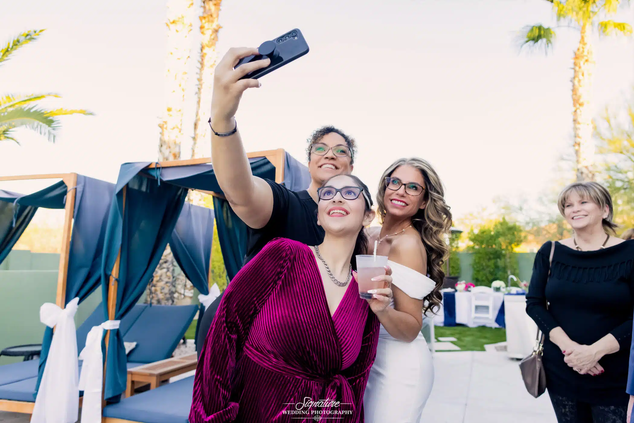 Image by Signature Wedding Photography friends of the bride taking a selfie with her
