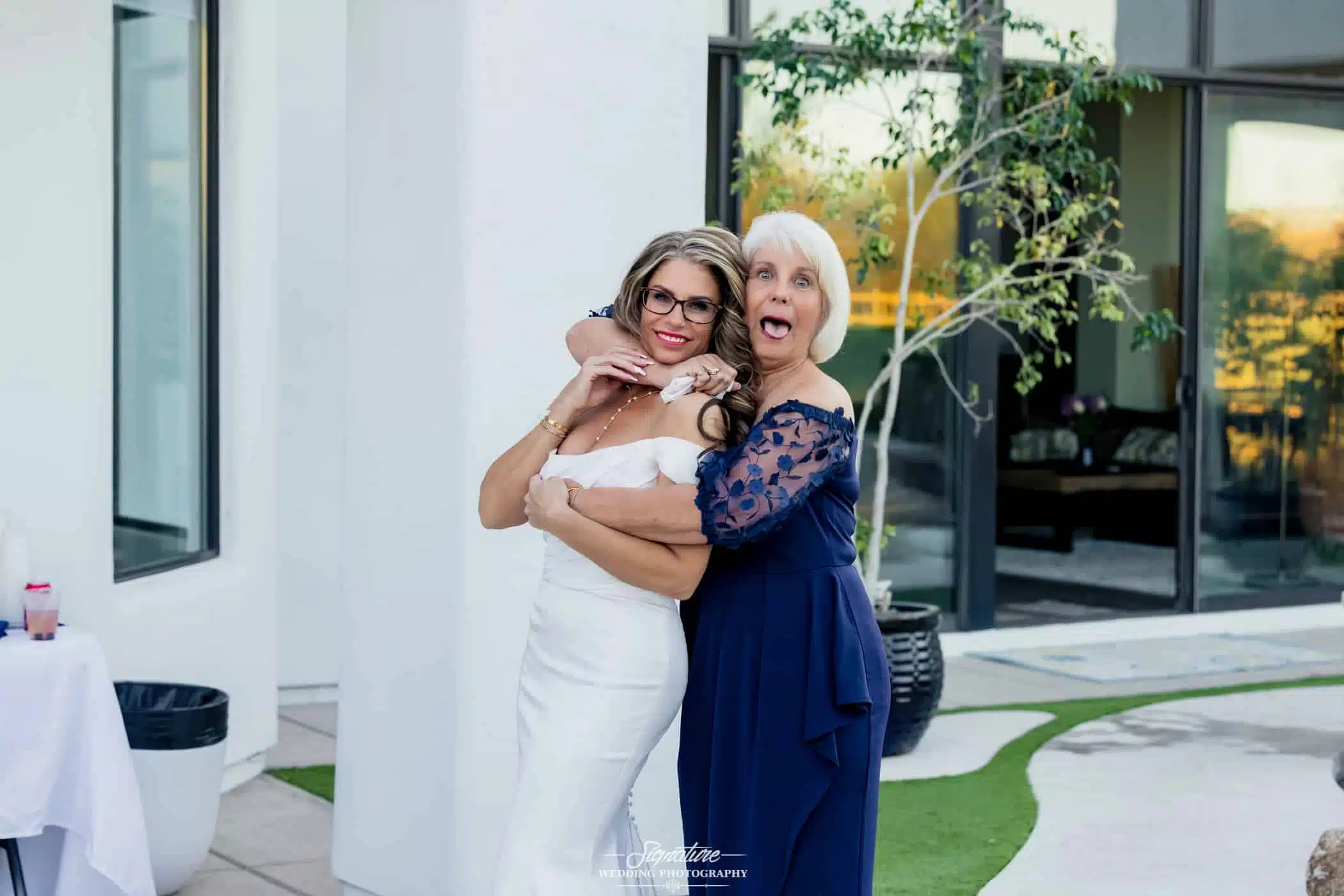 Image by Signature Wedding Photography bride and her mom in a candid moment