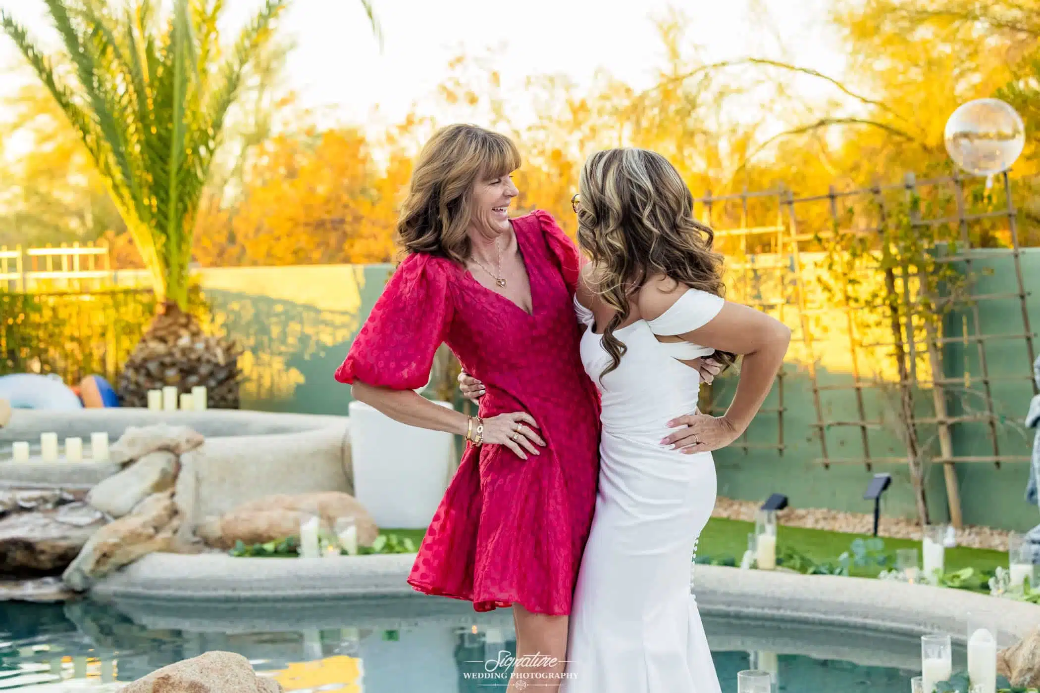 Image by Signature Wedding Photography soon to be bride laughing with her friend