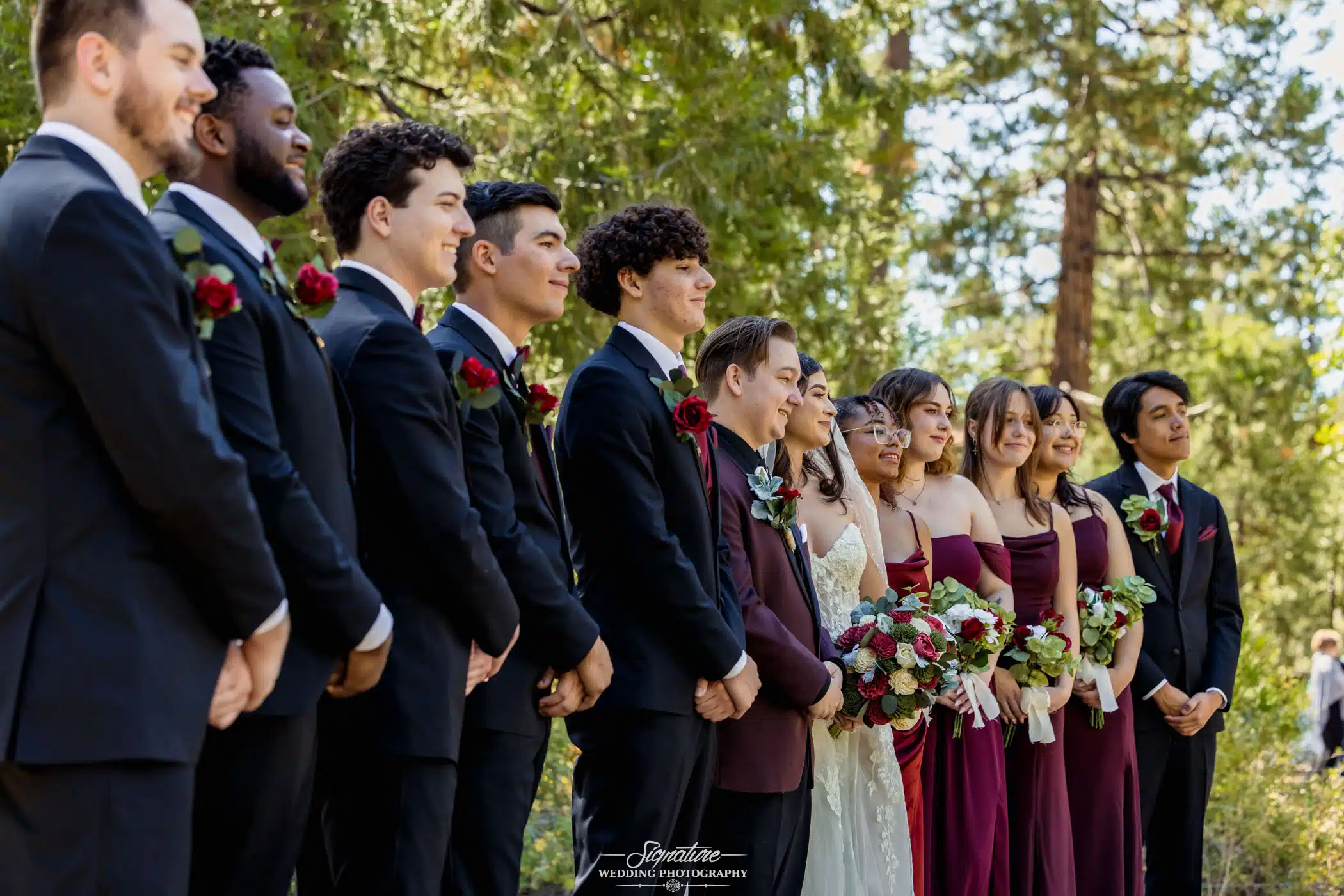 Image by Signature Wedding Photography entire wedding part in line listening attentively