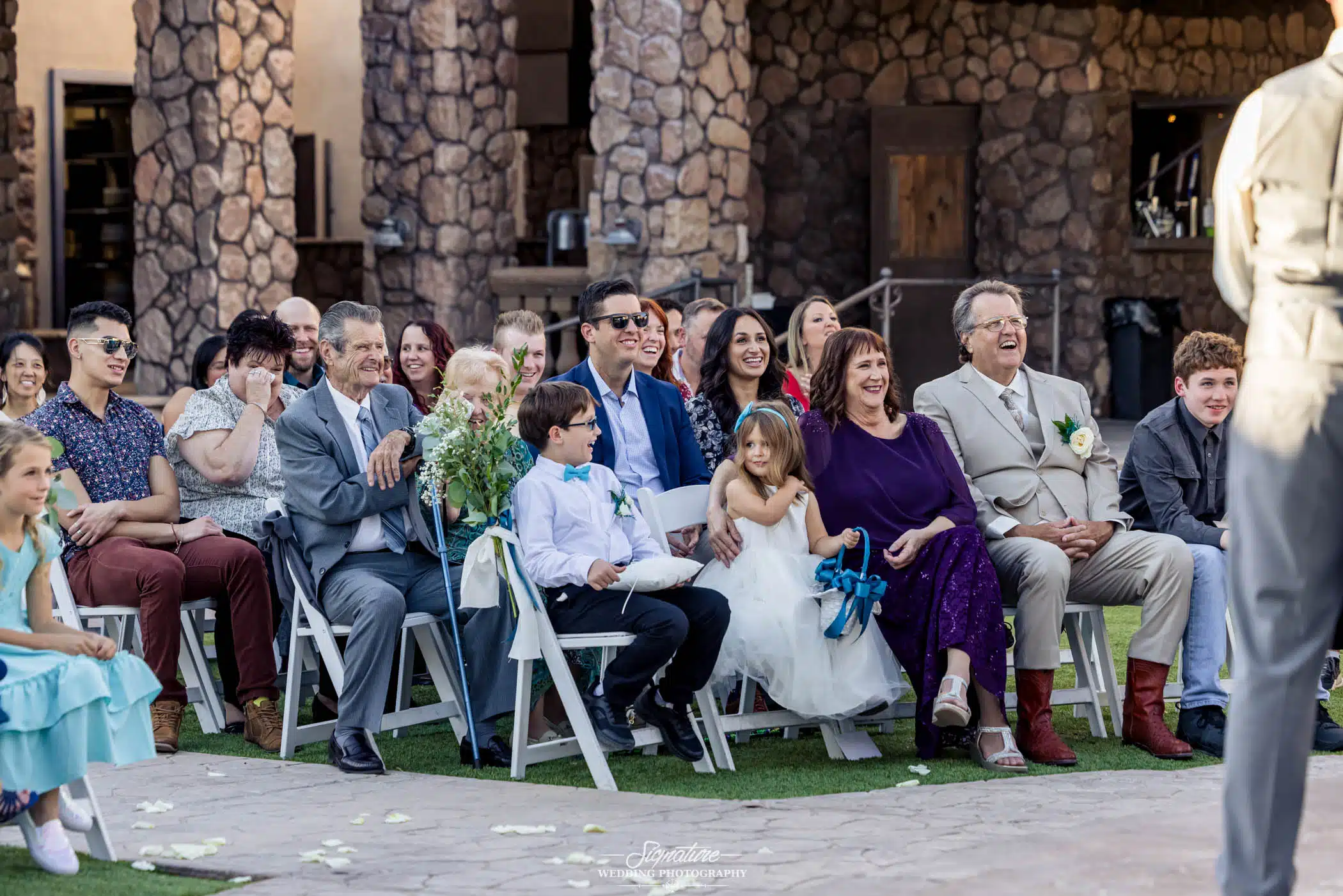 Image by Signature Wedding Photography candid photo of attendees at a wedding