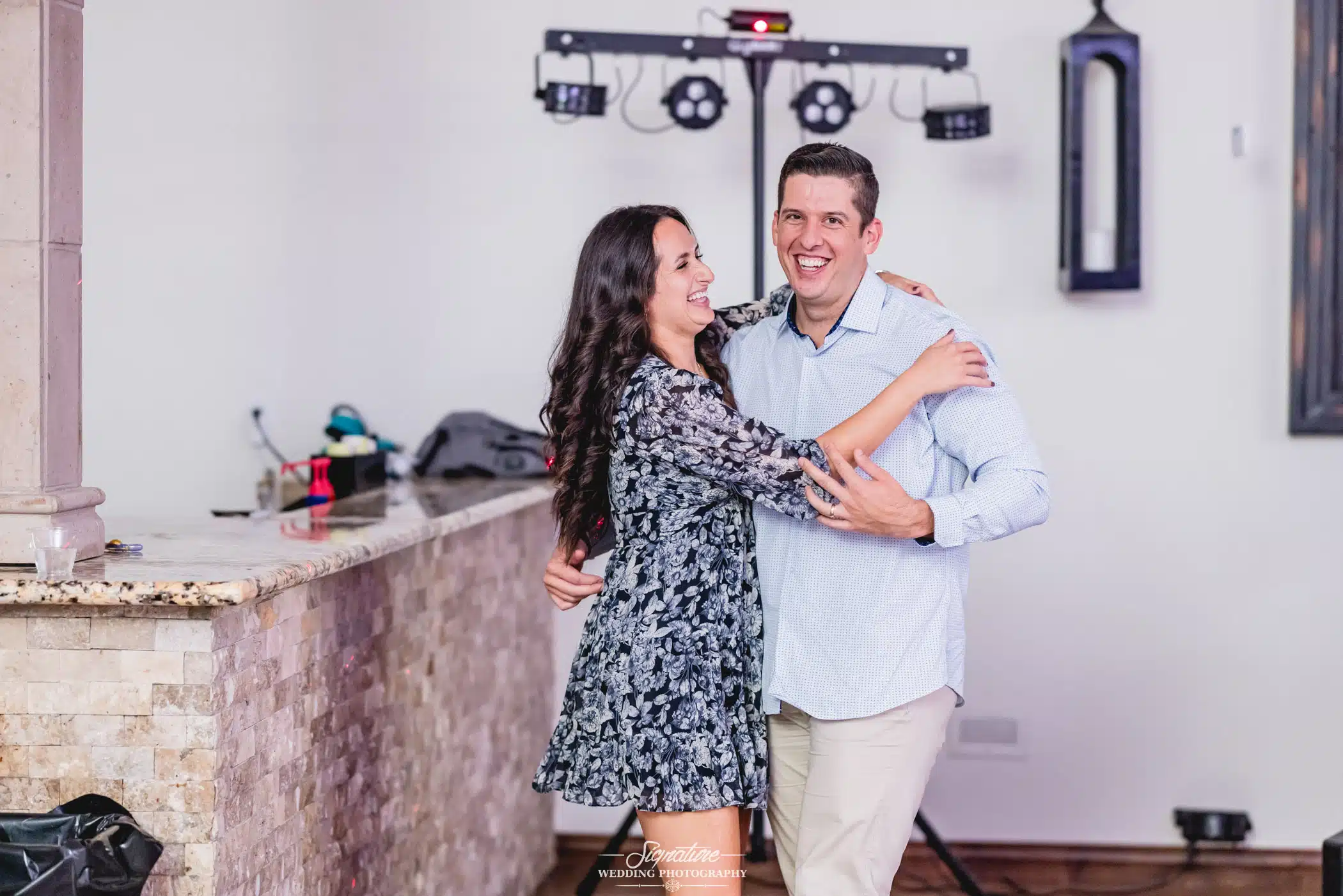 Image by Signature Wedding Photography happy couple hugging and laughing