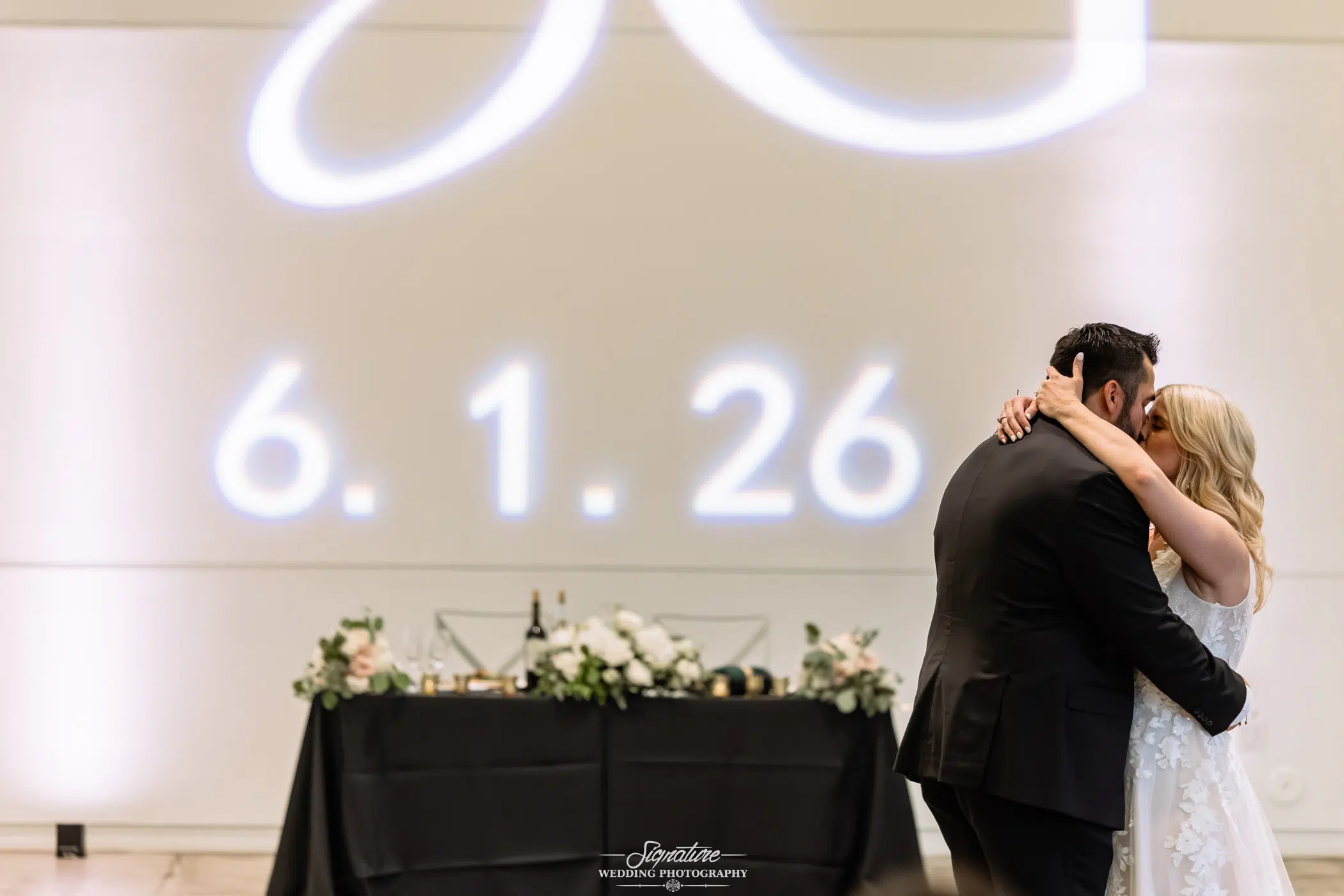 Bride and groom sharing their first dance at a wedding reception